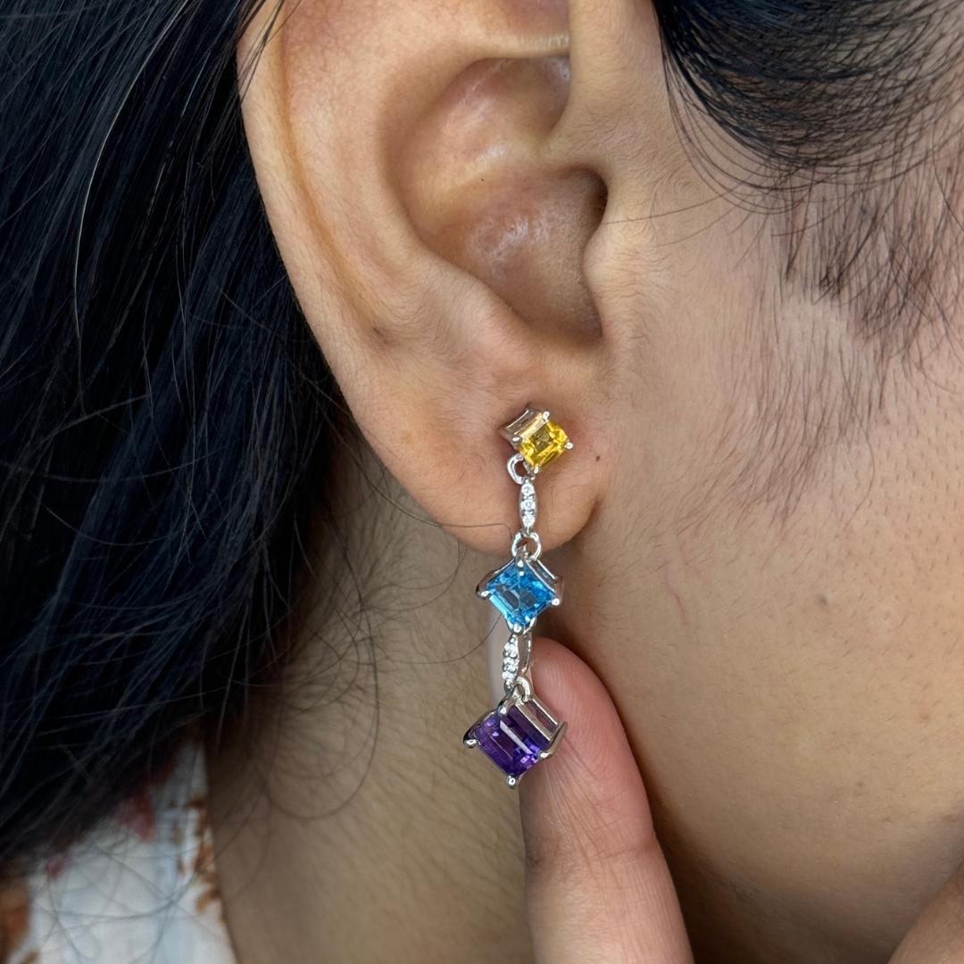 Natural Multi Gemstone Dangle Earrings in sterling silver to make a statement with your look. You shall need dangle earrings to make a statement with your look. These earrings create a sparkling, luxurious look featuring, square cut natural citrine,