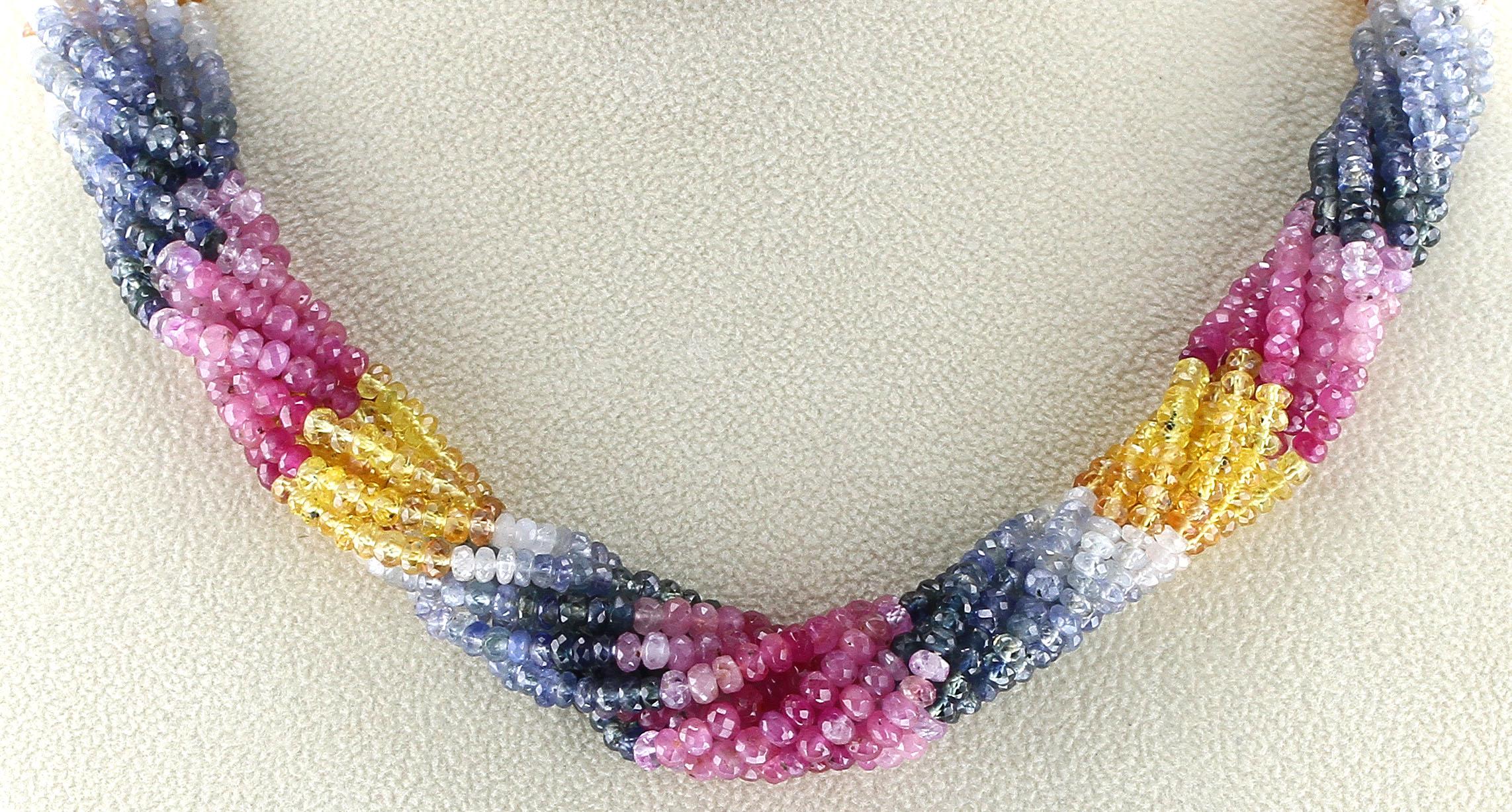 A 10 Strand Multi-Sapphire Choker with shades of pink, yellow, white, and blue. The choker can be twisted. 600 carats. 18K Clasp. 