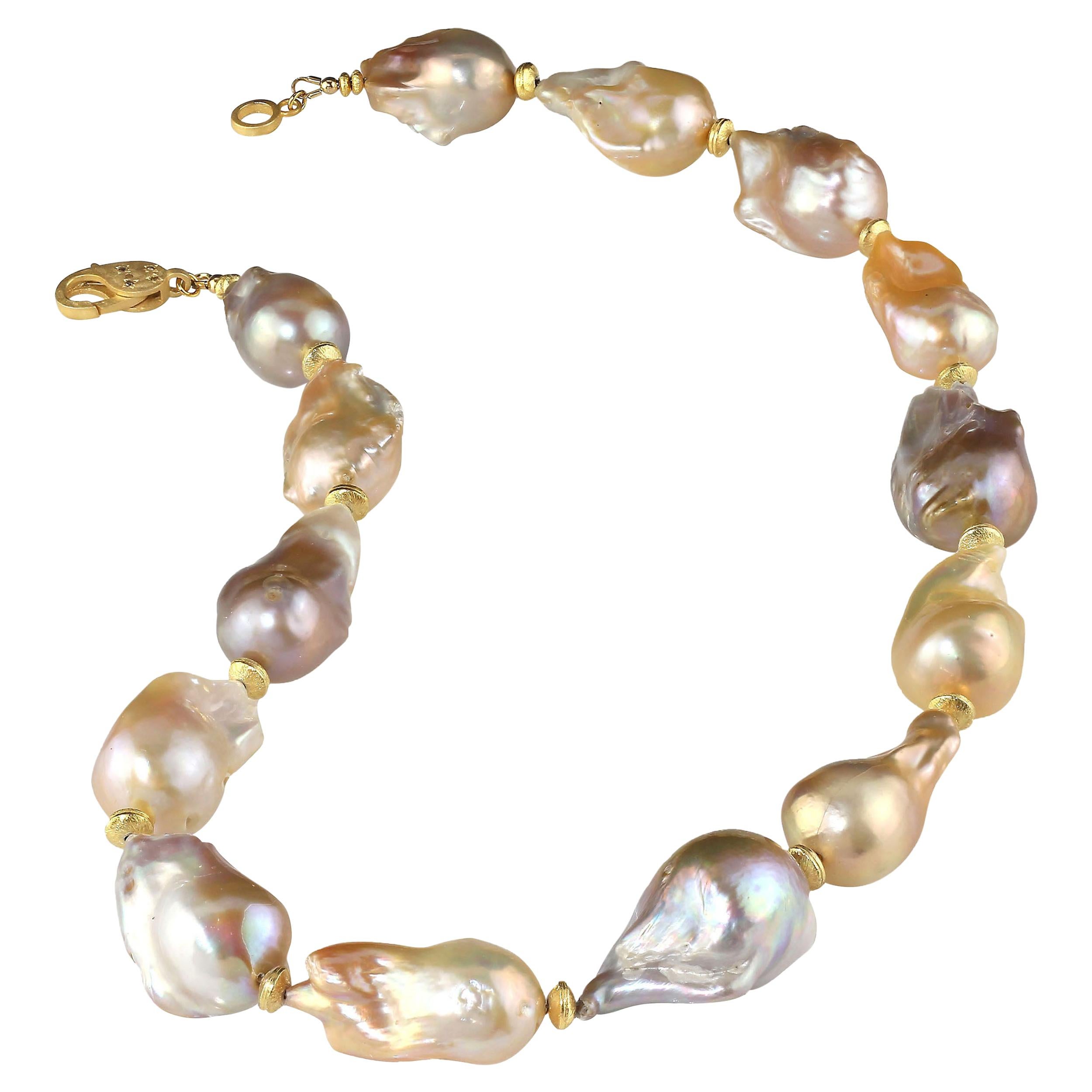 'Because you deserve to own Pearls'

Necklace of luscious, lustrous natural multi tone Baroque Pearls with gold accents. These huge, 30 x 18 MM, Baroque Pearls are gorgeous and complement all skin tones. This unique necklace features a vermeil (gold