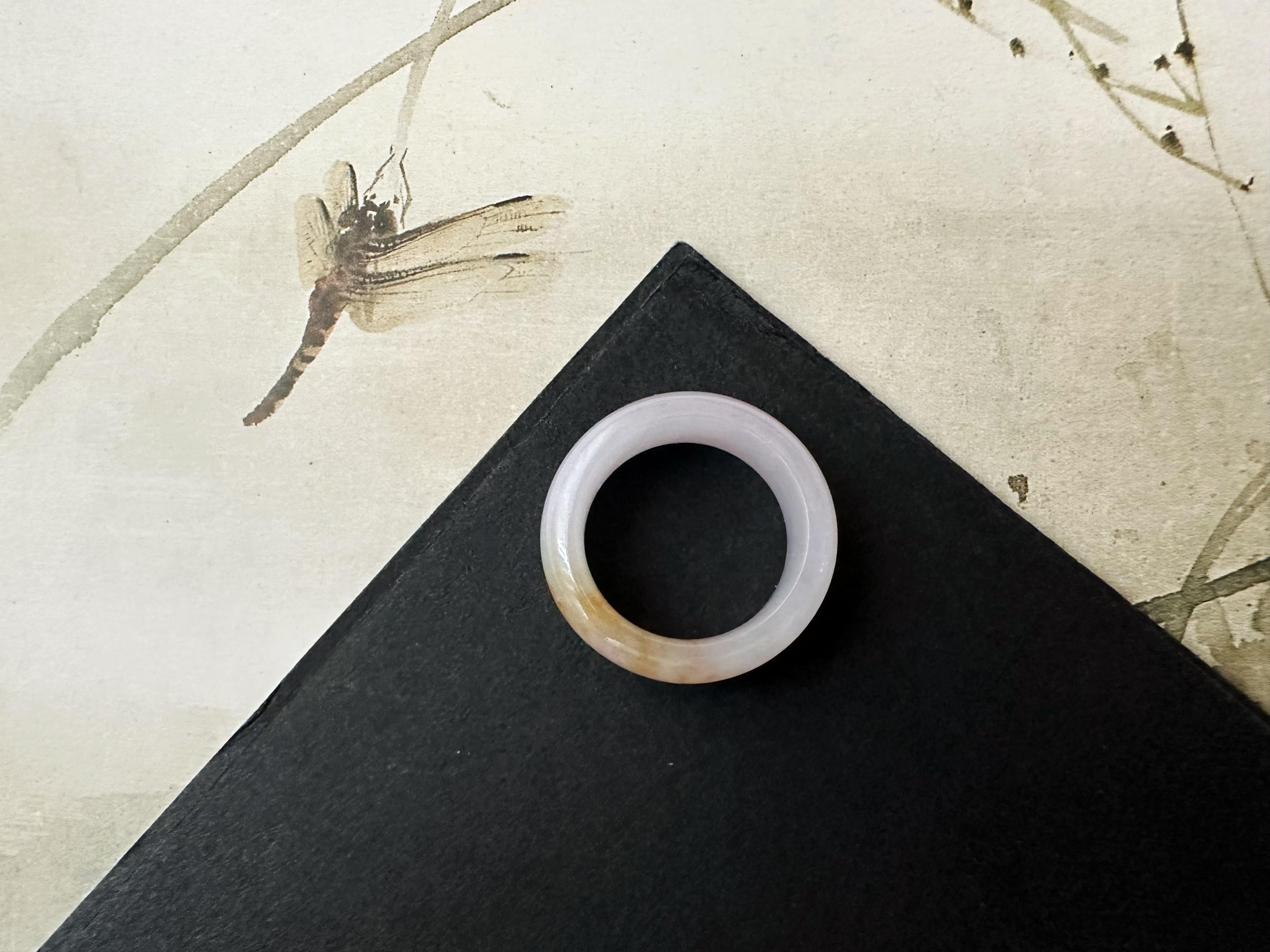 This jadeite band is 100% natural, untreated and undyed Type-A Myanmar jadeite jade. It is hand-carved. Its pink and golden yellow bicolor is unique. The ring has a fine texture and vitreous luster. The sense of touch is cool.

This natural jadeite