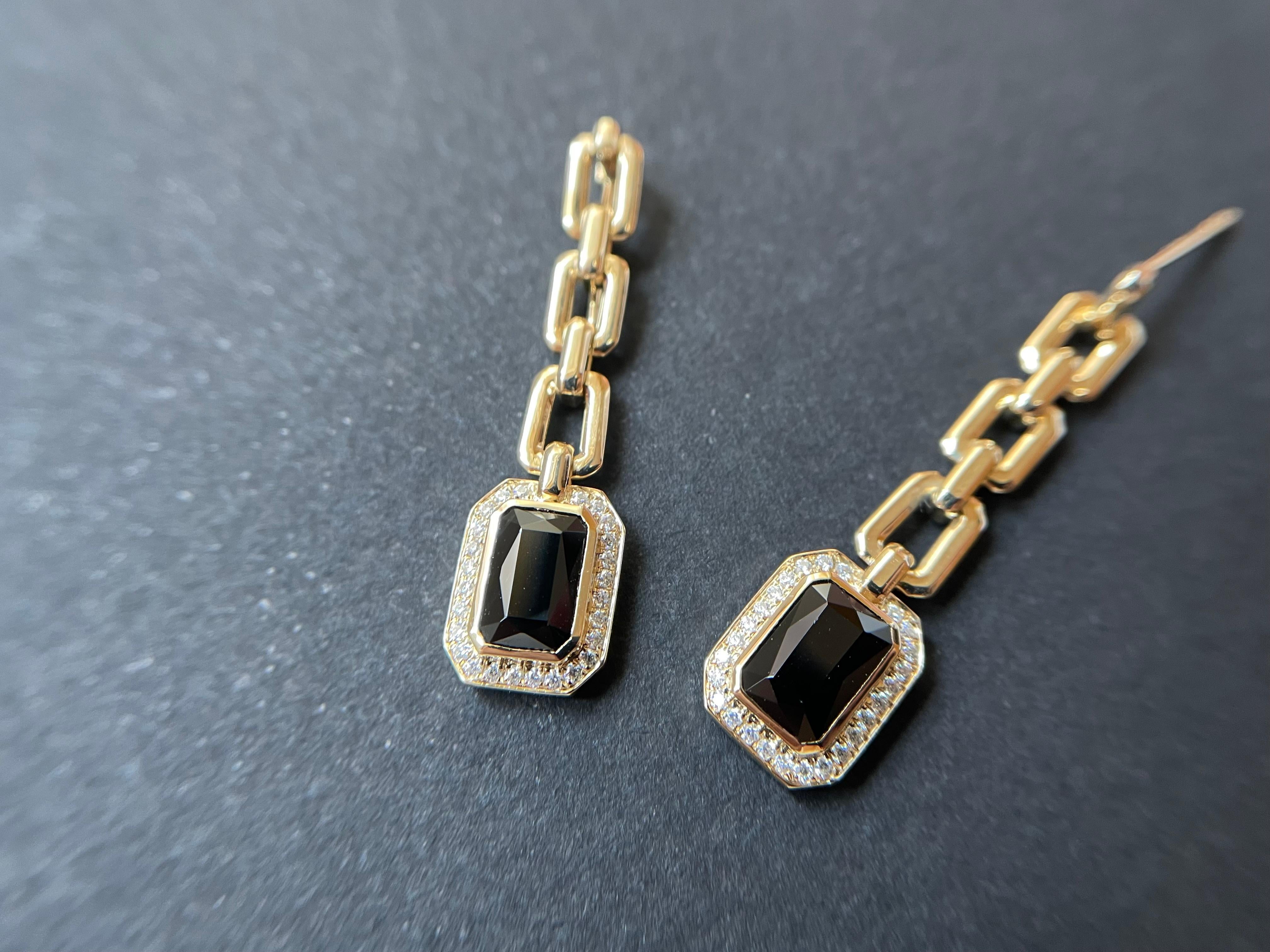 The custom-designed and handcrafted earrings are set in Myanmar black spinels. These luxurious ear studs are framed in 14K /18K yellow gold embellished with moissanite. It is simply just a one-of-a-kind gem piece. The vivid, intense black color