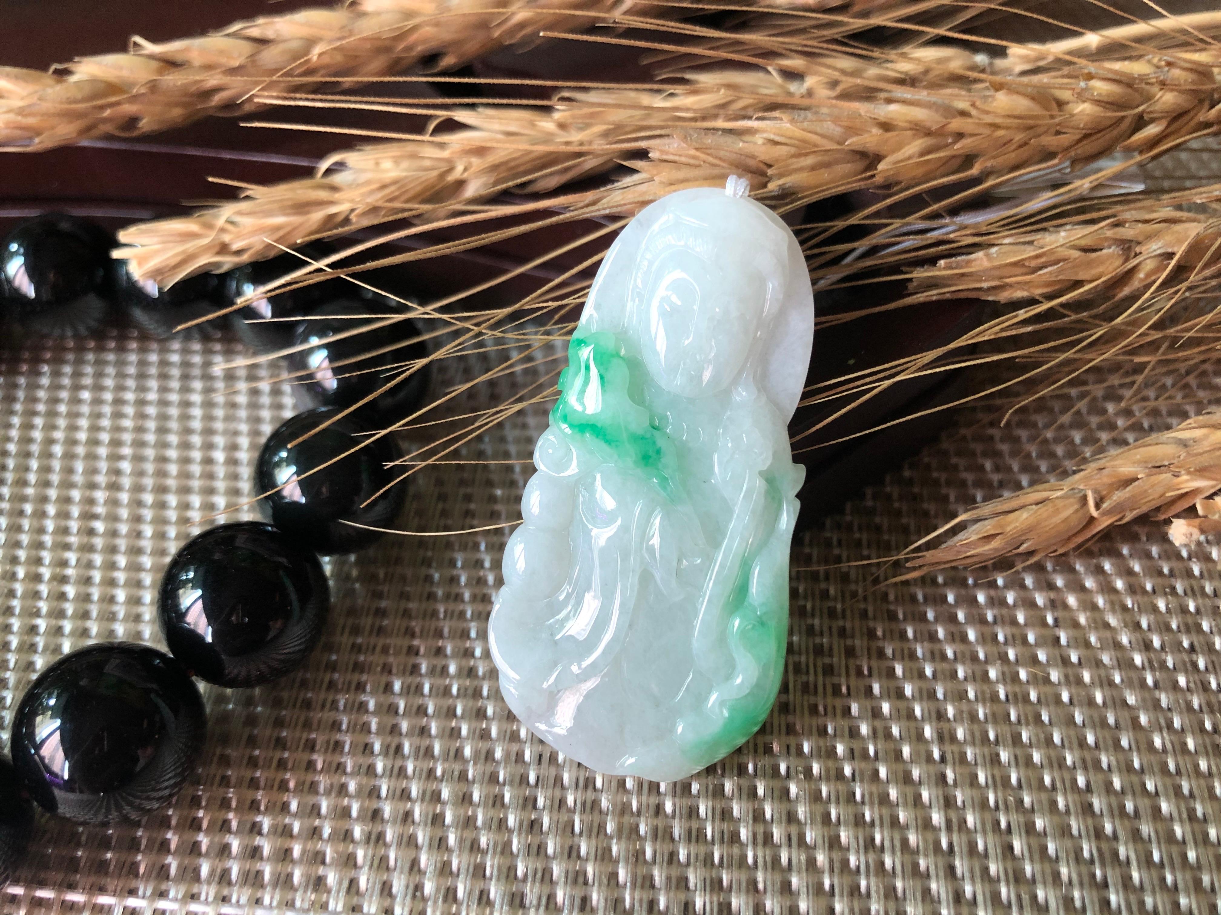This jade pendant is 100% natural, untreated and undyed Type-A Myanmar jadeite jade. It is hand-carved into Guan Yin.  Beautiful translucent, faint milky white with green patches gifted by Mother Nature make this pendant simply unique and