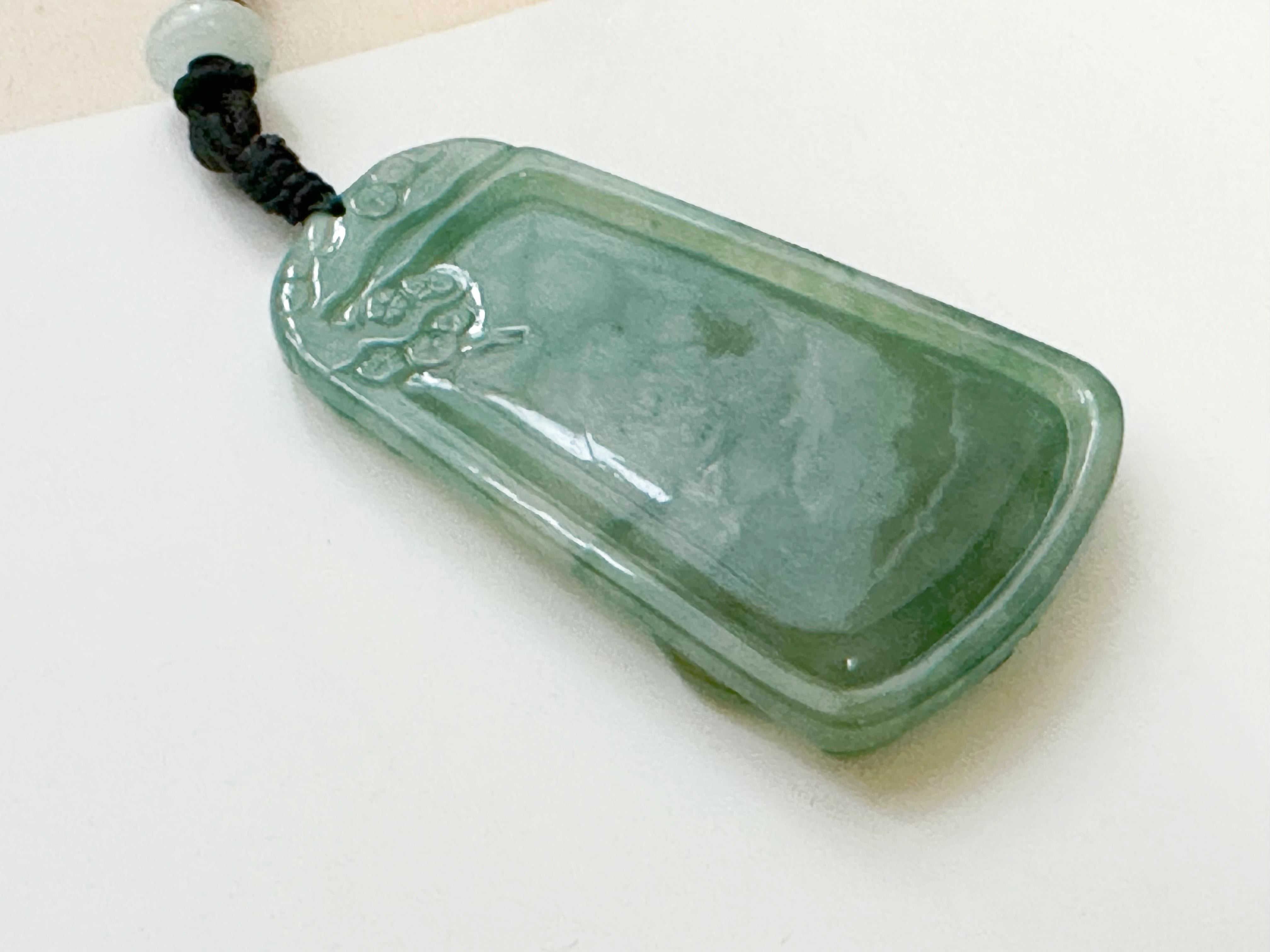 Artisan Natural Myanmar Hand Carved Teal Green Icy Type Tiger Jadeite Pendant For Sale