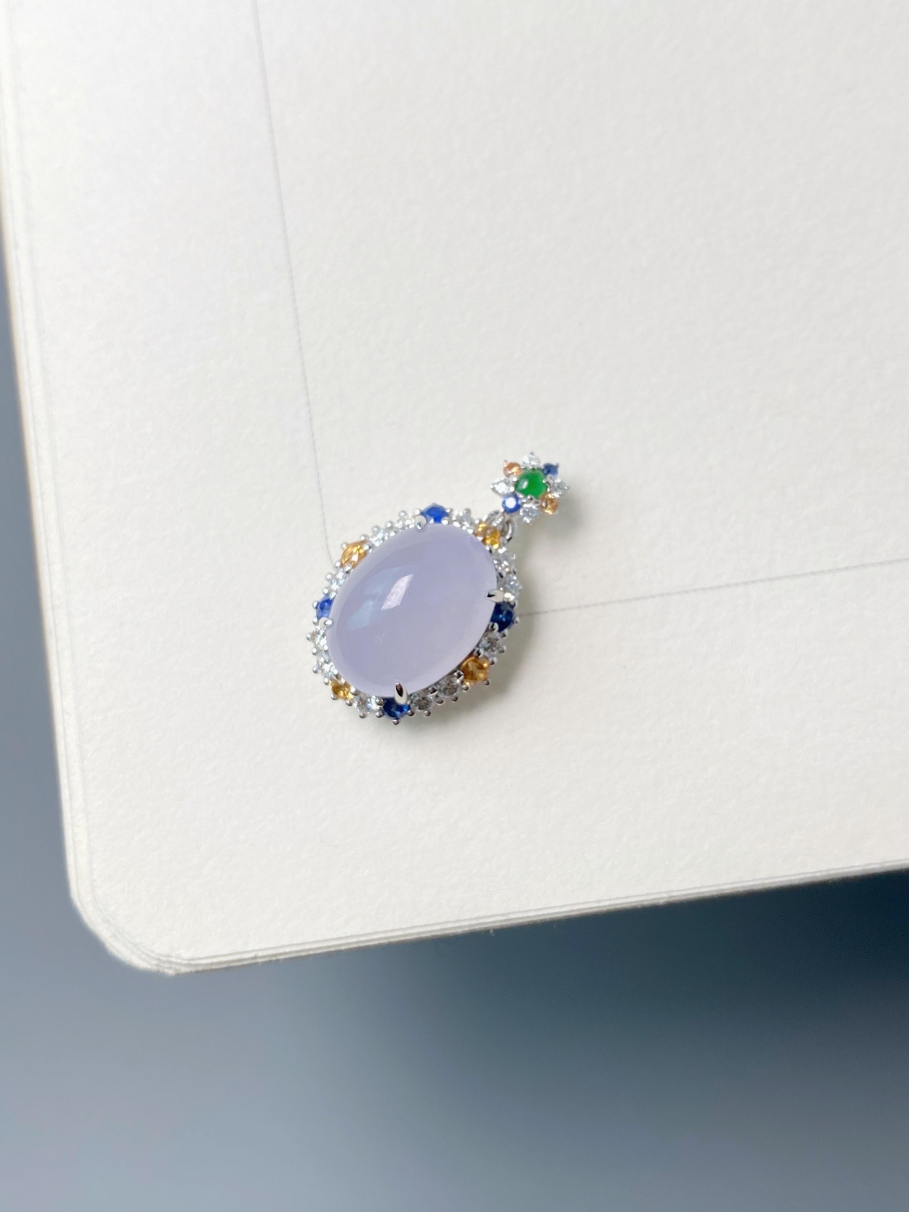 Discover the elegance of our custom-designed, handcrafted pendant featuring rare Myanmar lavender icy jadeite. This modern piece is beautifully accented with vibrant blue and yellow sapphires alongside high-quality diamonds.
Lavender jadeite is a