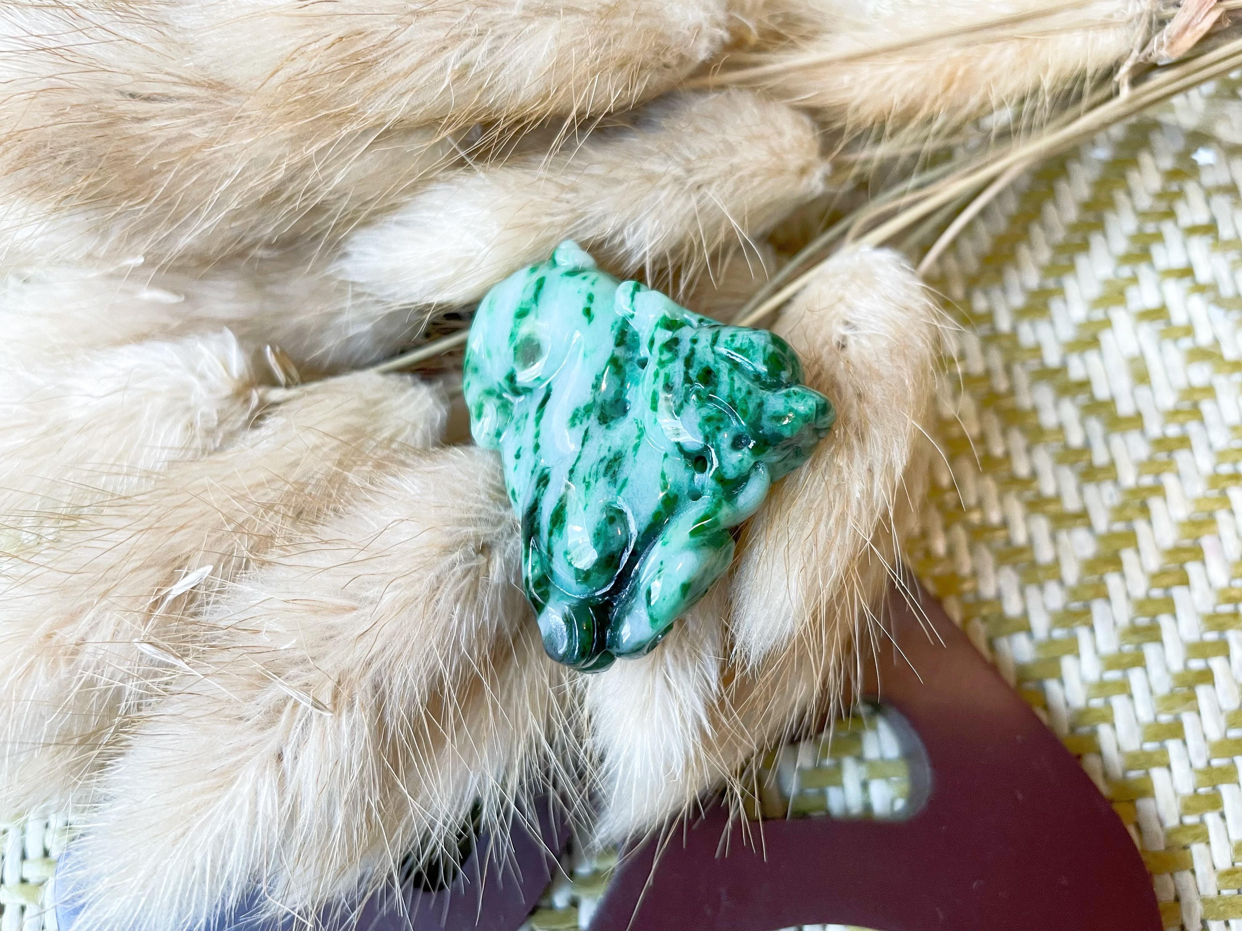 Bring a touch of mystique and prosperity to your life with this exquisite hand-carved PiXiu pendant, made from 100% natural Type A Myanmar jadeite. PiXiu is a powerful mythical creature that resembles a strong, winged lion, and is known for its