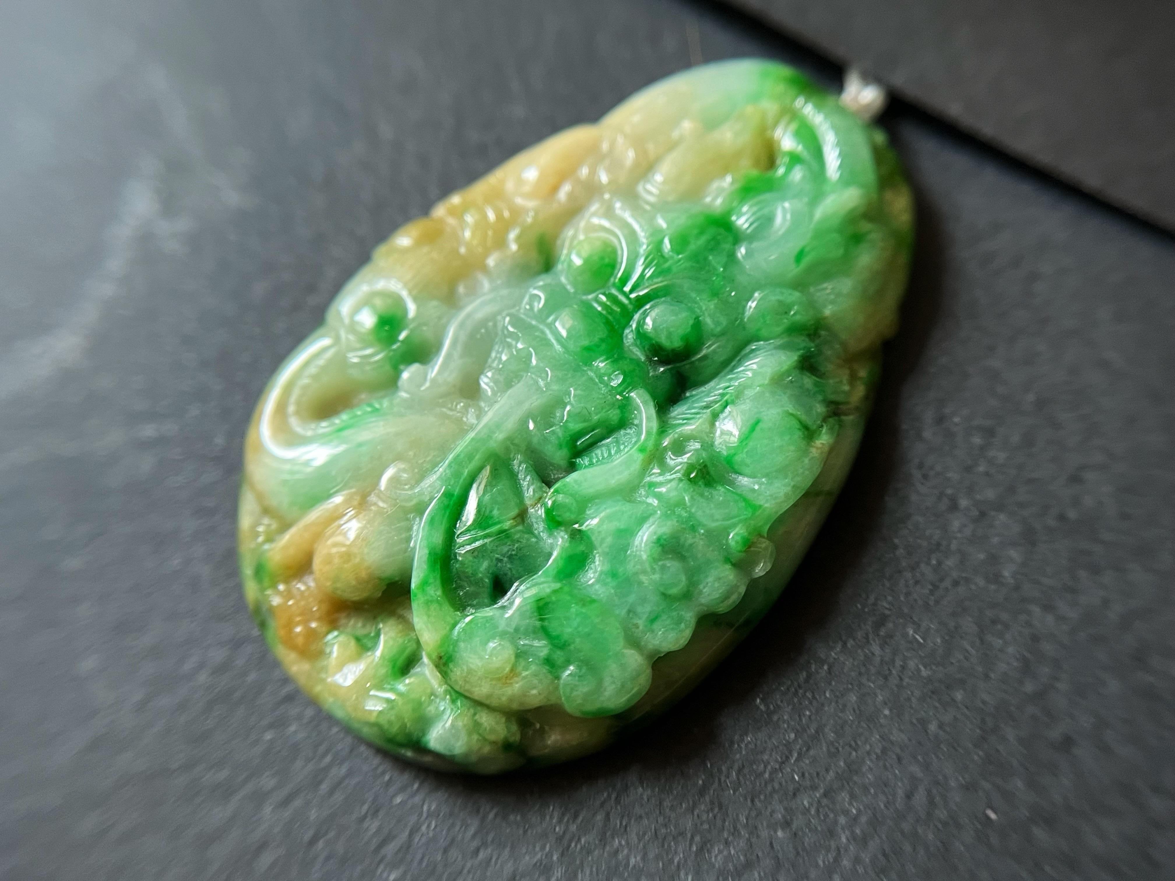 This exquisite masterpiece is carved from the finest 100% natural, untreated, and undyed Type-A Myanmar jade. This one-of-a-kind pendant boasts a unique tricolor of vivid green, honey-yellow, and white hues gifted by Mother Nature herself, making it