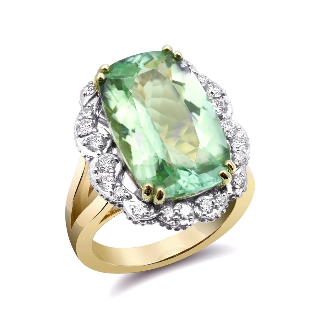 Experience the captivating allure of natural Namibian tourmaline with this exquisite 14K white and yellow gold ring. Complemented by sparkling diamonds, this piece showcases exceptional craftsmanship and the vibrant beauty of these precious
