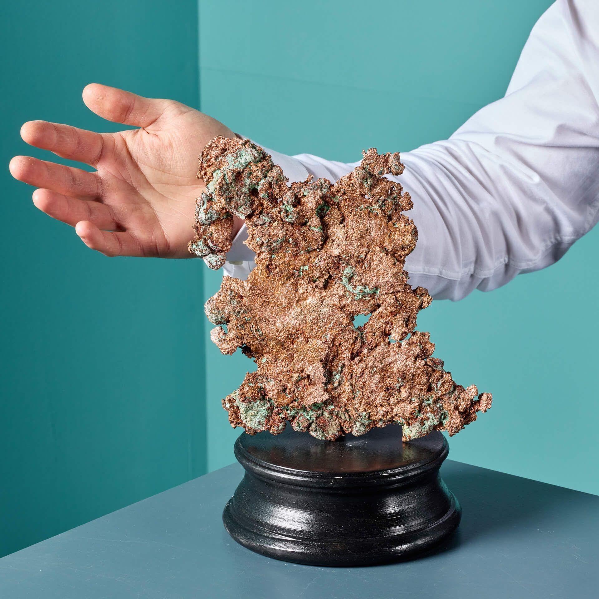 This is a natural sculptural form of a copper ore specimen originating from Chile. Naturally formed over millions of years, this copper ore cluster showcases a deep orange, bronze-like colour with a metallic lustre, typical of the variety.

The