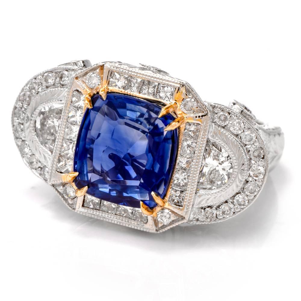 his elaborately designed and meticulously constructed cocktail ring is handcrafted in solid 18-karat white gold. This ring exposes a GIA certified, no heat cushion-cut natural corundum sapphire of Madagascar provenance weighing 4.94 carats,