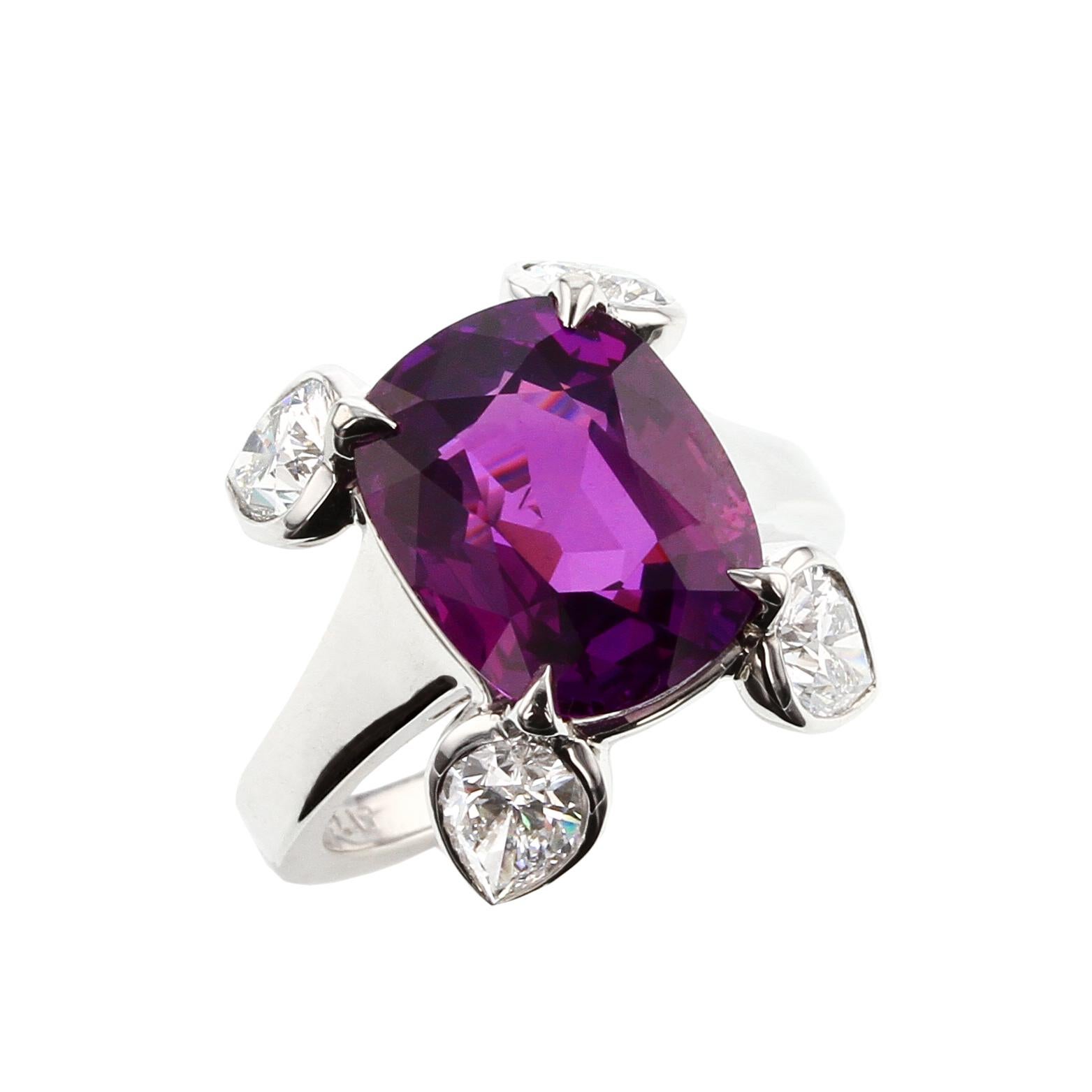 A beautiful and natural, no heat purple sapphire weighing 8.61 carats set with four pear-shape diamonds, set in Platinum. The sapphire accompanies a gemological certificate from GIA stating the origin as Ceylon (Sri Lanka) with No Indications of