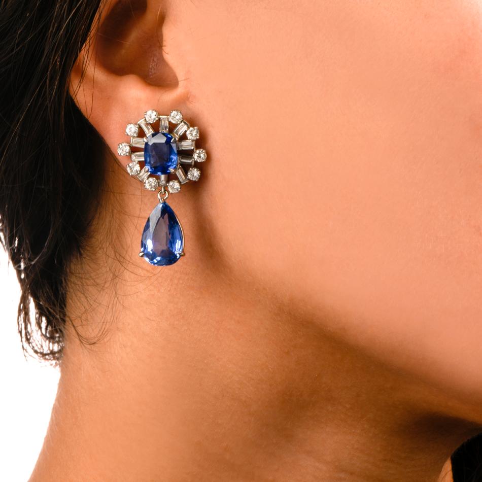 These glamorous sapphire and diamond dangle drop earrings are crafted in solid platinum, weighing 21.7 grams and measuring 37mm long x 20mm wide (max). Displaying 4 natural no heat sapphires without any treatments. All individually tested by GIA and
