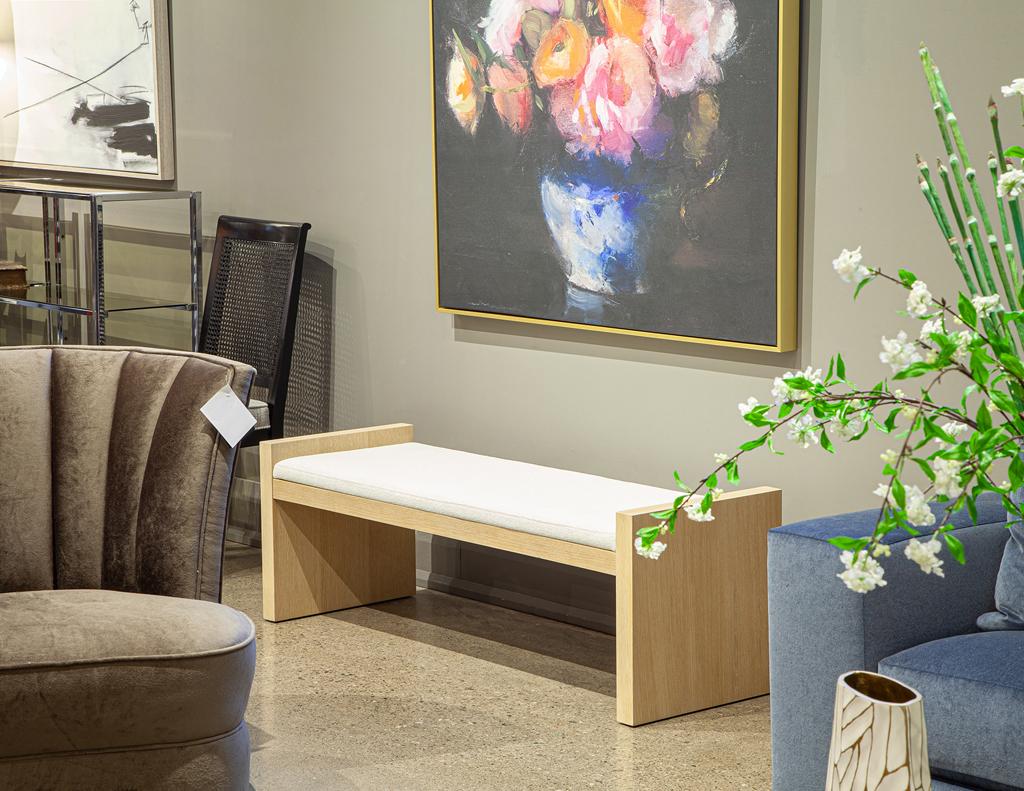 Elevate your space with this handcrafted Natural Oak Bench by Carrocel. Featuring a sleek, minimalistic design, it blends contemporary elegance with timeless craftsmanship. The natural oak frame showcases rich wood grain detailing, while the