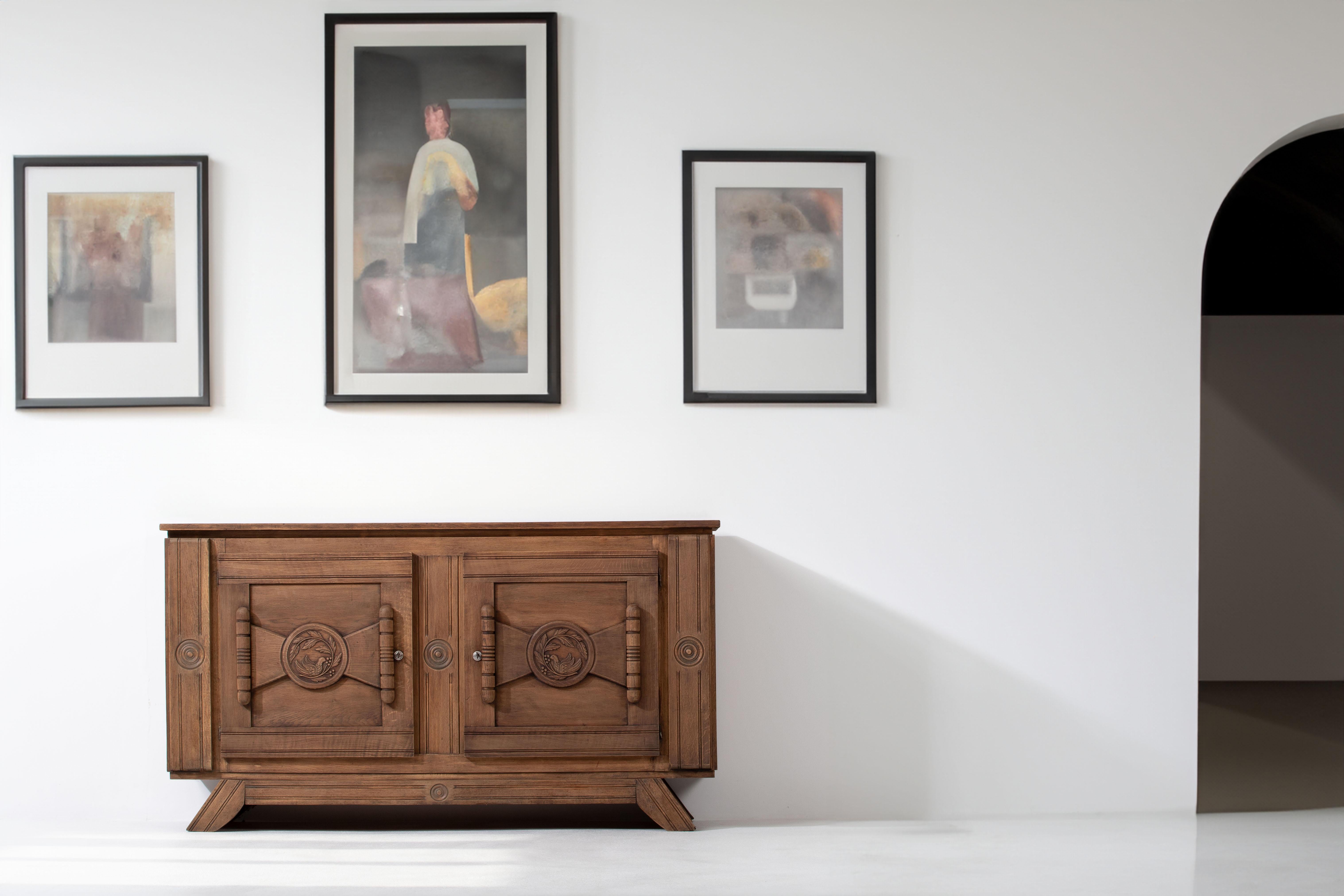 Unearthed in Normandy, this Breton-style sideboard in solid oak boasts a stunning brutalist look that brings a touch of raw and powerful design to any space. With two spacious storage compartments, this remarkable piece offers both functionality and