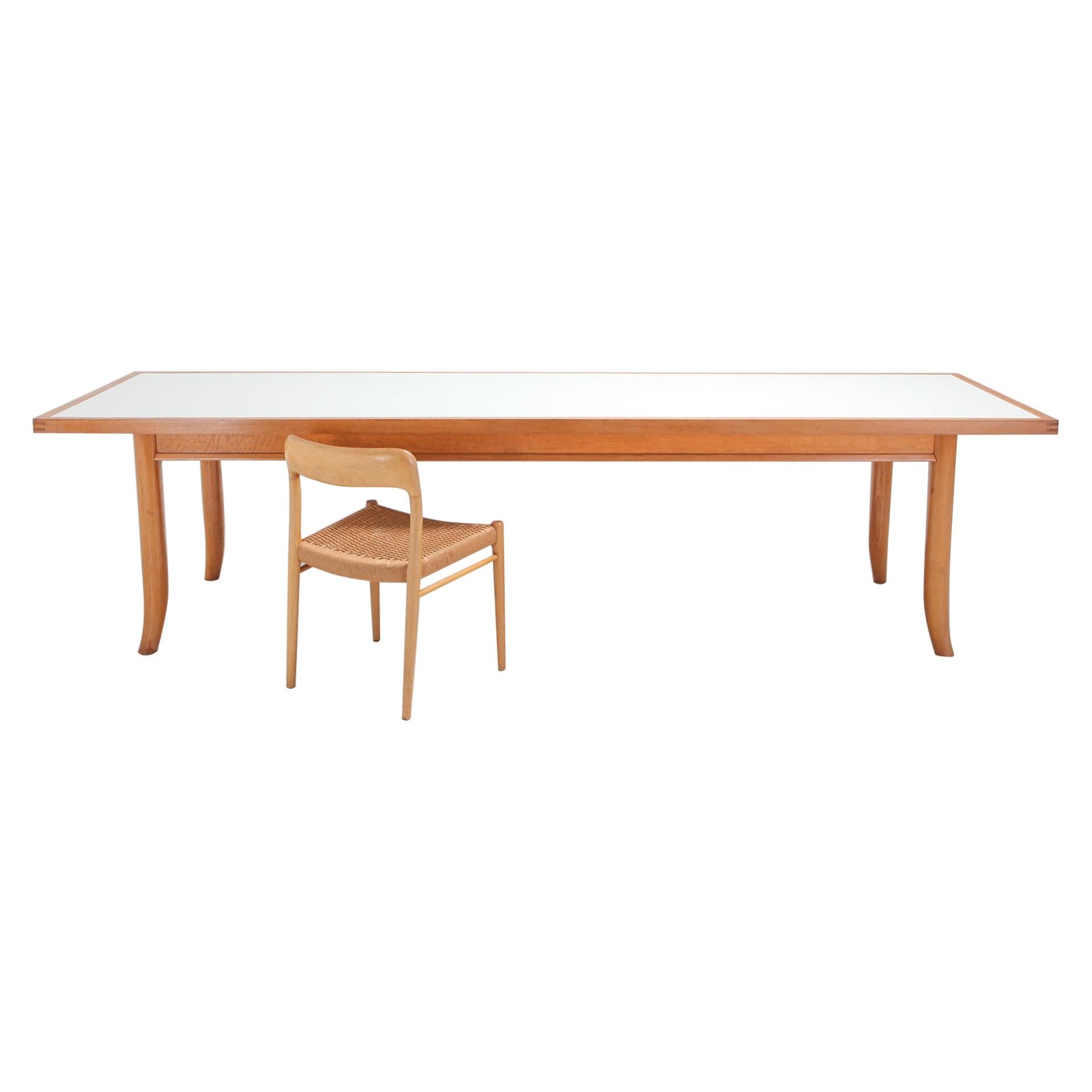 George Nakashima style over size oak dining table, designed by Robsjohn-Gibbings.

Robsjohn-Gibbings worked for the same company as Nakashima called Widdicomb. 
This particular piece is more high-end than the Widdicomb furniture pieces so it was