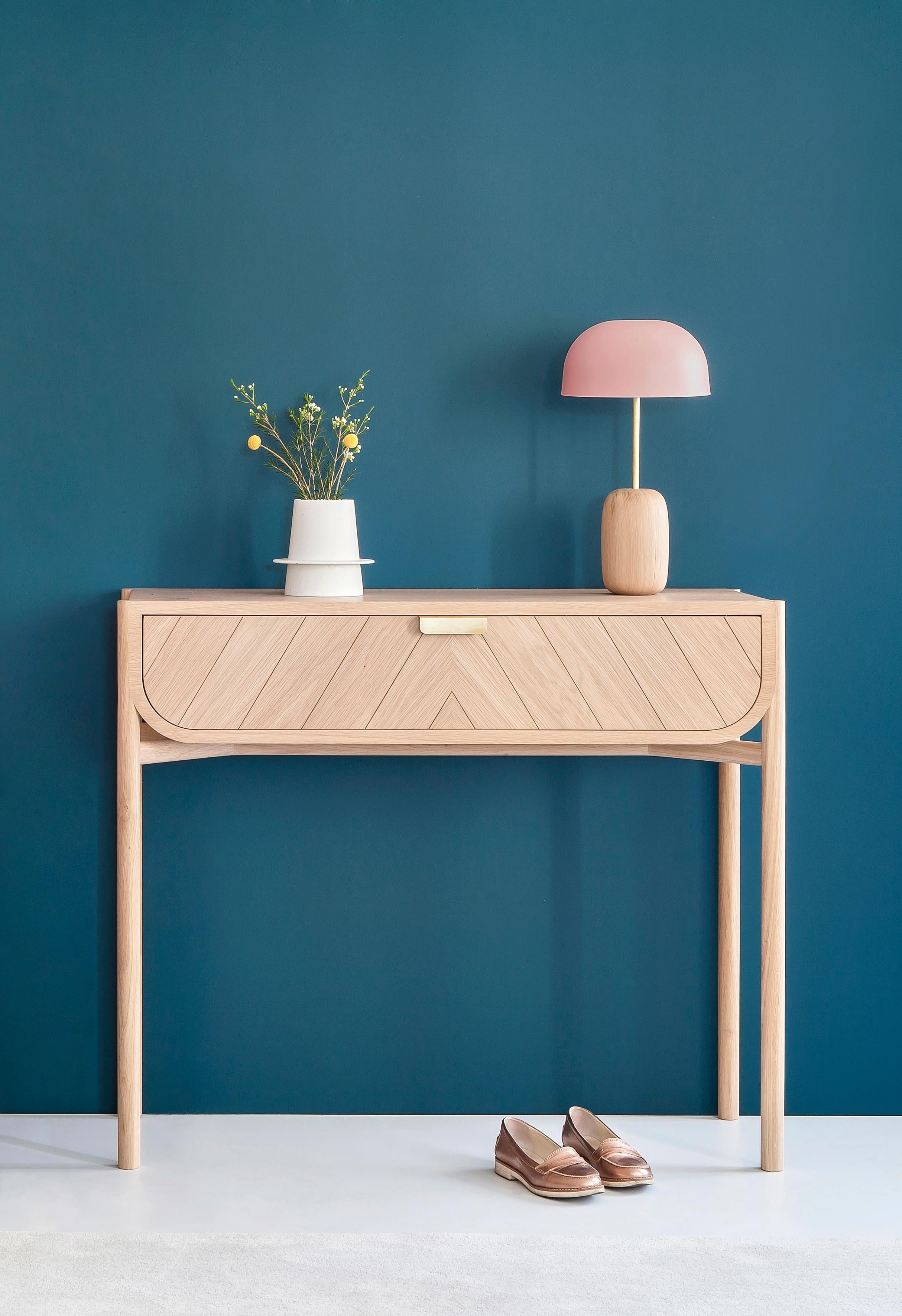 Natural Oak Marius Console Table by HARTO
Dimensions: W 100 x D 36.5 x H 90 cm. 
Materials: Solid Wood, MDF wood veneer.  
Weight: 20.0 kg

The Marius console, with its drawer engraved with chevrons and its refined brass handle, is suitable for all