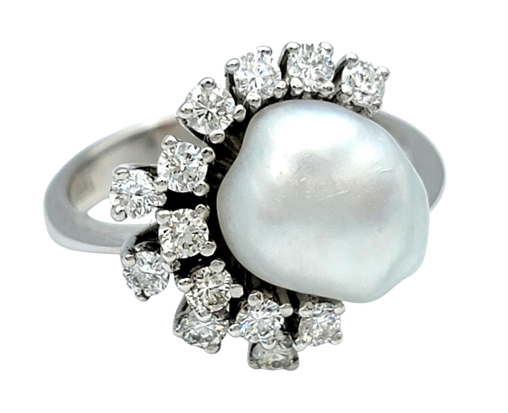 Ring size: 5.75

Experience the serene elegance of the ocean with this breathtaking pearl and diamond ring. A luminous ocean pearl takes center stage, exuding timeless sophistication with its creamy luster. Surrounding the pearl on one side, a