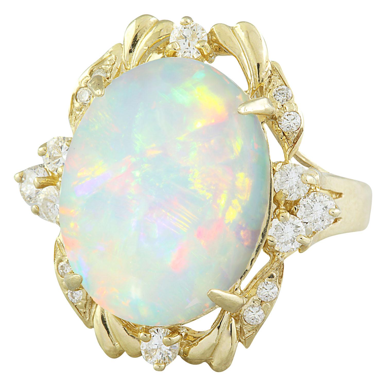 8.87 Carat Natural Opal 14 Karat Solid Yellow Gold Diamond Ring
Stamped: 14K 
Total Ring Weight: 6.7 Grams
Opal Weight 8.27 Carat (16.00x12.00 Millimeters)
Treatment: None
Diamond Weight: 0.60 Carat (F-G Color, VS2-SI1 Clarity )
Treatment: None
Face