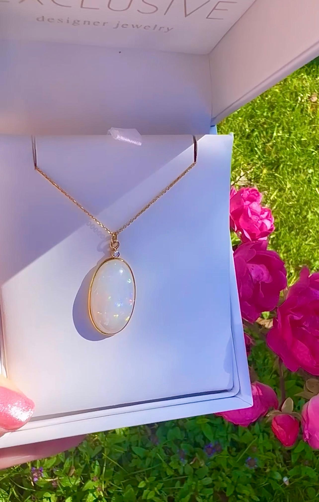 Luxurious Opal Bezel 18K gold necklace. This lovely charm has shimmering opal in an oval shape full of play of color. Breathtaking! Must see! Truly a beautiful necklace for opal lovers! 
Luxurious look. 
Length 16 inches-18inches
The pendant is 1.2