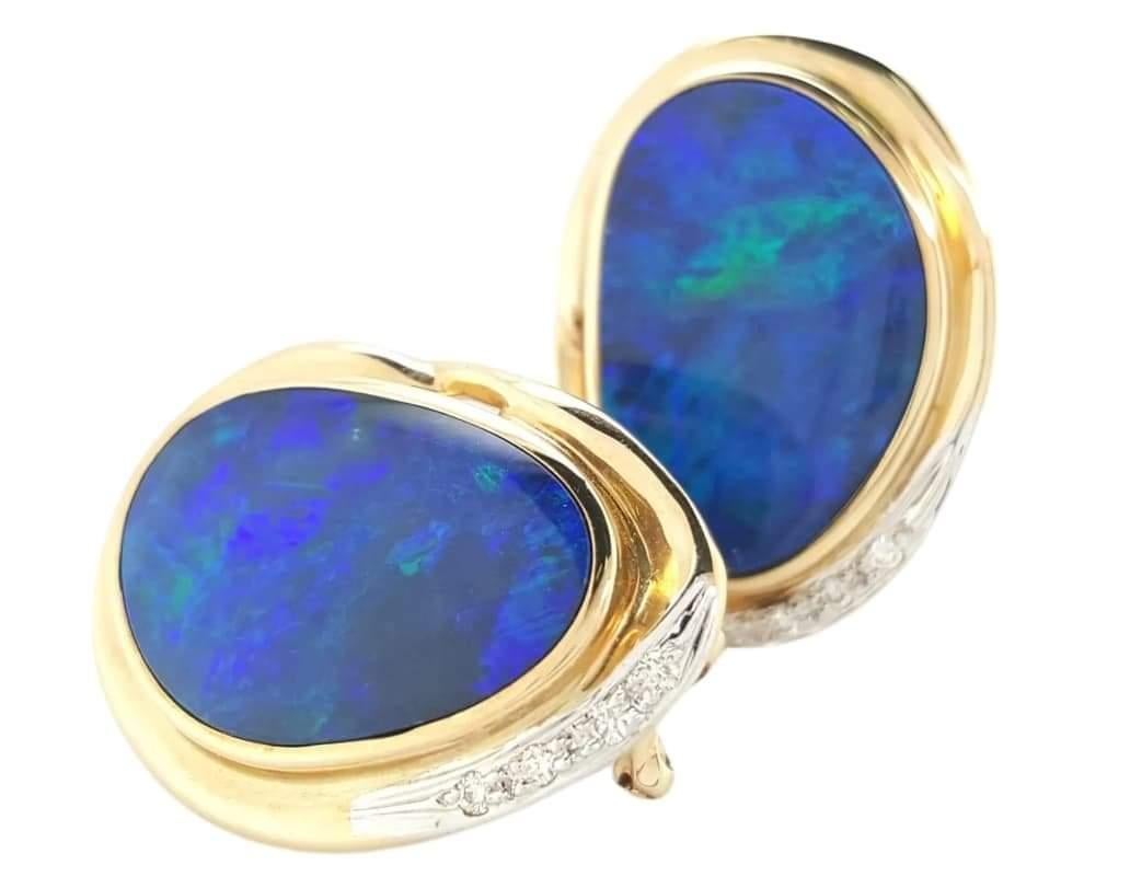 Oval Cut Natural Opal and diamond Stud Earrings Encased in 14 Karat Yellow Gold Bezels