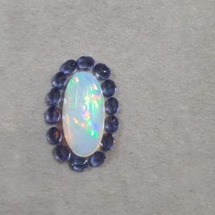 Natural Opal And Tanzanite pendant with diamonds in 18 Karat White Gold