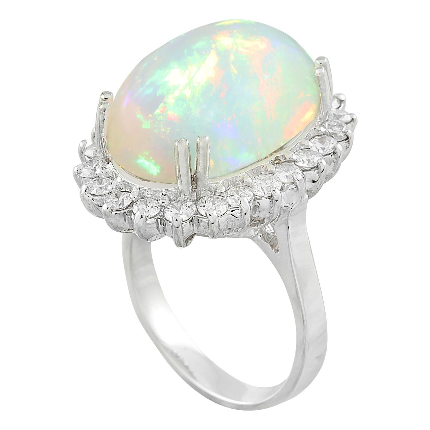 9.15 Carat Natural Opal 14 Karat Solid White Gold Diamond Ring
Stamped: 14K 
Ring Size 7
Total Ring Weight: 7.1 Grams 
Opal Weight 8.05 Carat (18.00x13.00 Millimeters)
Natural Opal Treatment: None 
Diamond Weight: 1.10 carat (F-G Color, VS2-SI1