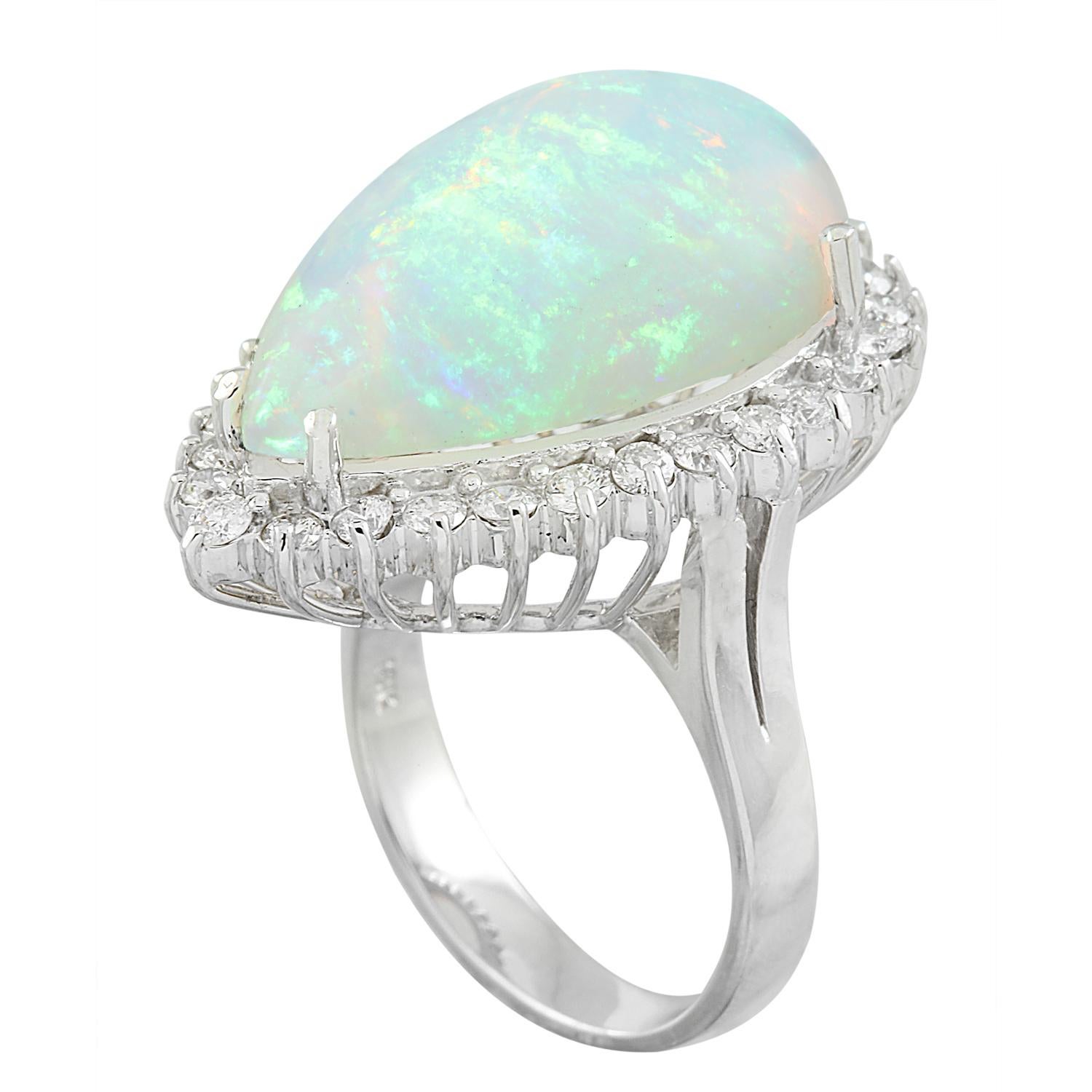 14.00 Carat Natural Opal 14 Karat Solid White Gold Diamond Ring
Stamped: 14K 
Ring Size 7
Total Ring Weight: 12.7 Grams 
Opal Weight 12.90 Carat (22.00x14.00 Millimeters)
Natural Opal Treatment: None
Diamond Weight: 1.10 Carat (F-G Color, VS2-SI1