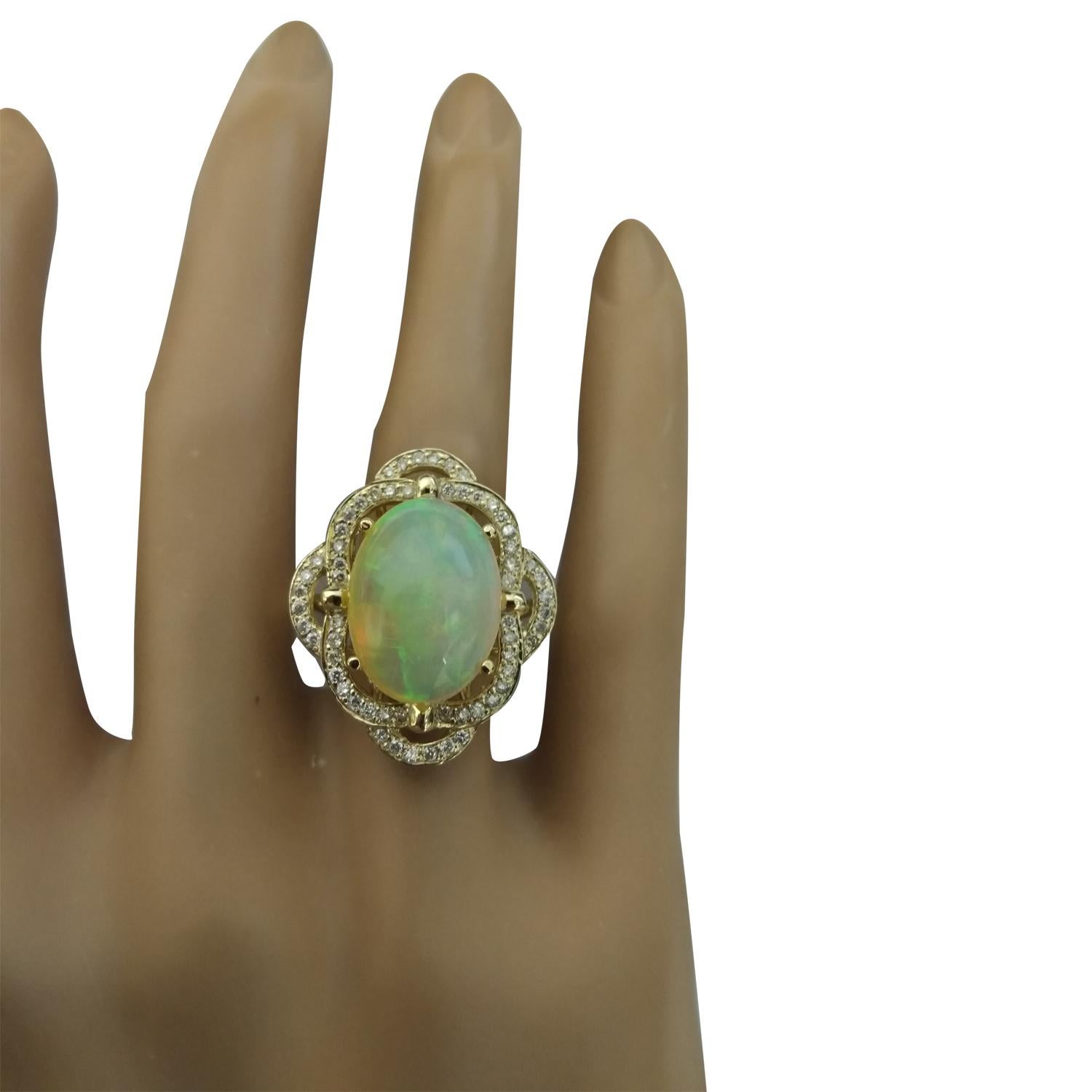 7.05 Carat Natural Opal 14 Karat Solid Yellow Gold Diamond Ring
Stamped: 14K 
Total Ring Weight: 7 Grams 
Opal Weight 6.55 Carat (16.00x12.00 Millimeters)
Diamond Weight: 0.50 carat (F-G Color, VS2-SI1 Clarity ) 
Face Measures: 25.40x21.55
