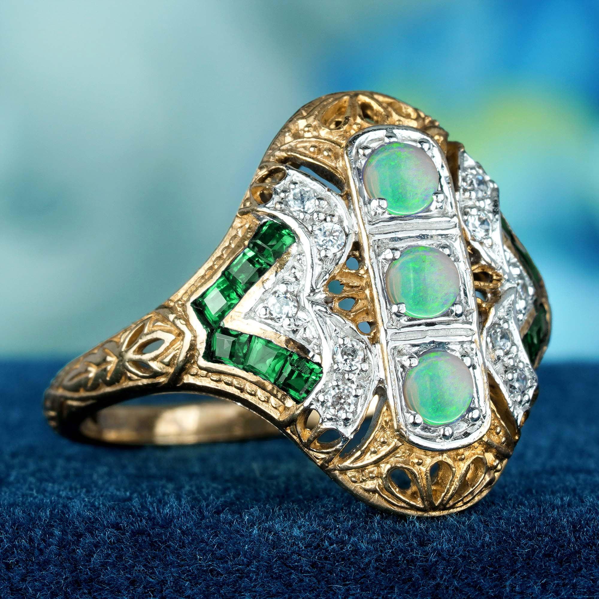 Presentamos nuestro impresionante Anillo de Tres Piedras Vintage de Ópalo Natural y Diamante Esmeralda, una pieza impresionante que refleja la elegancia del diseño Art Déco. Este exquisito anillo presenta una cautivadora disposición de auténticas
