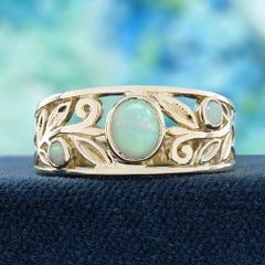 Anillo ancho con banda ancha y motivos en espiral de ópalo natural en oro amarillo macizo de 9K