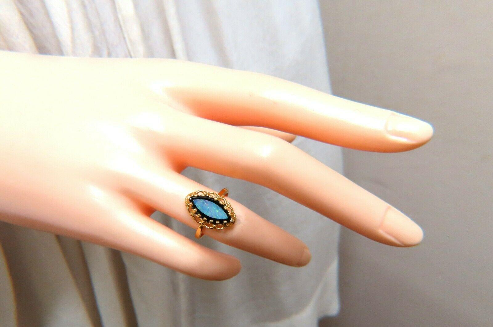 Natural Australian opal onyx ring

2ct natural opal

Deco ring 16x11 mm

Depth of ring 5.5 mm

14 karat yellow gold 3.5 g

Size 6.25 and we may resize please inquire

Please notice small chip on opal at 11:00 position