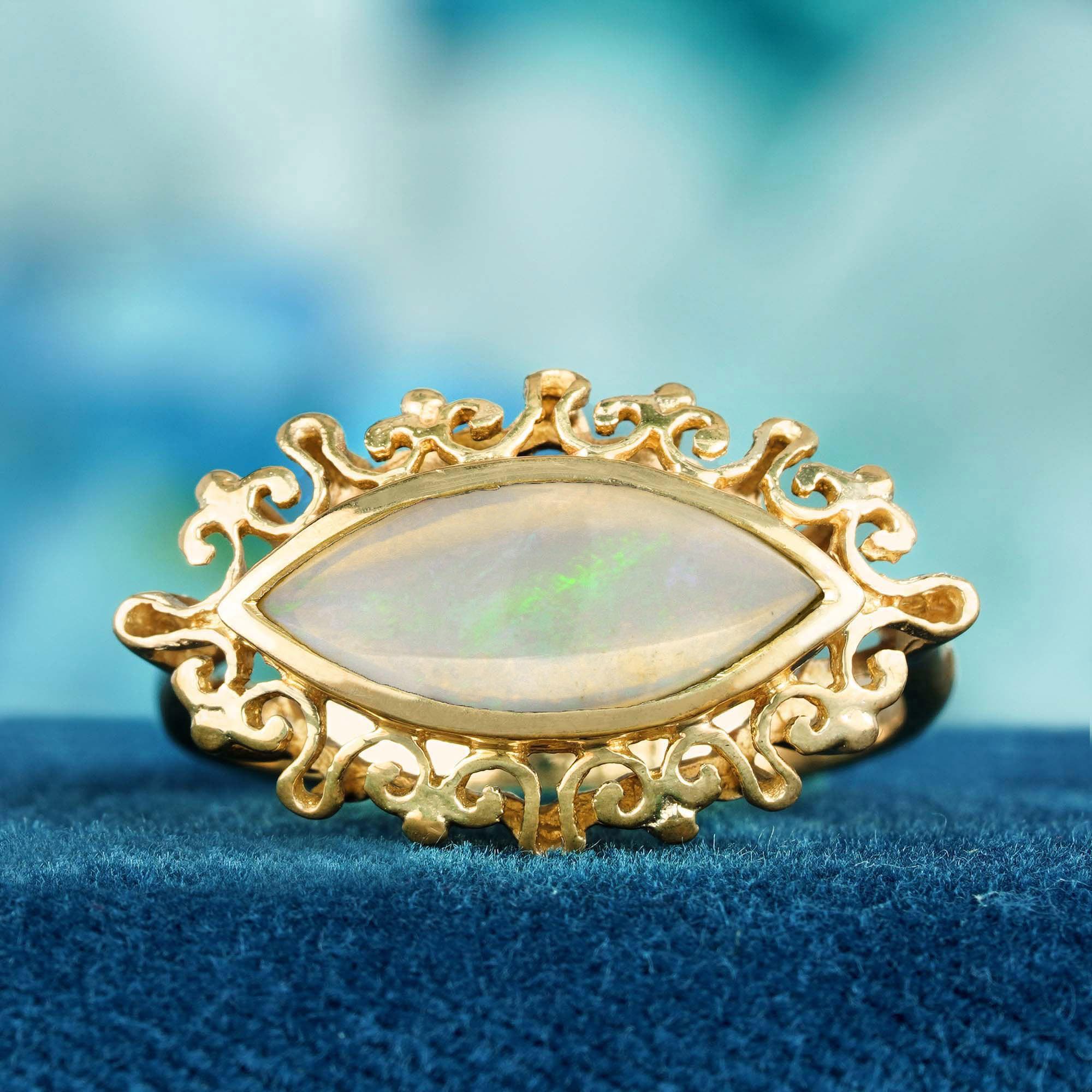 Treten Sie ein in eine Welt zeitloser Eleganz mit unserem Ring aus massivem Gelbgold mit einem natürlichen Opal in Marquise-Form im Vintage-Stil. Dieser exquisite Cocktailring ist mit einem atemberaubenden Opal im Marquiseschliff besetzt, der für