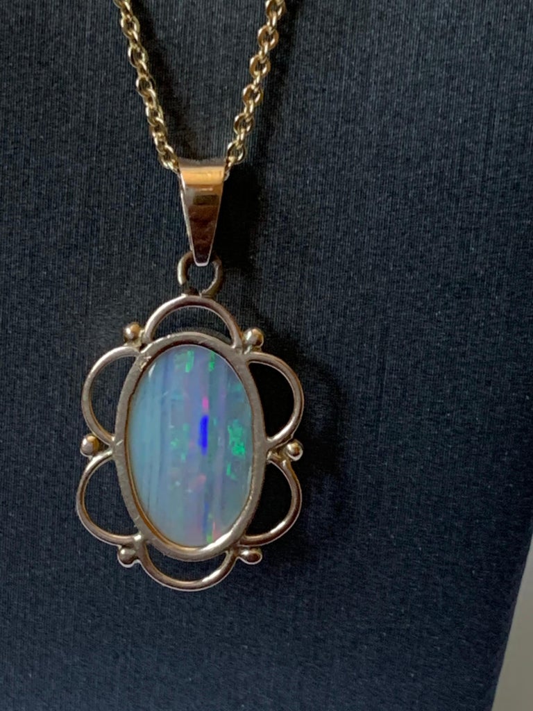 Natural opal pendant set in 14 Karat Yellow Gold For Sale at 1stDibs