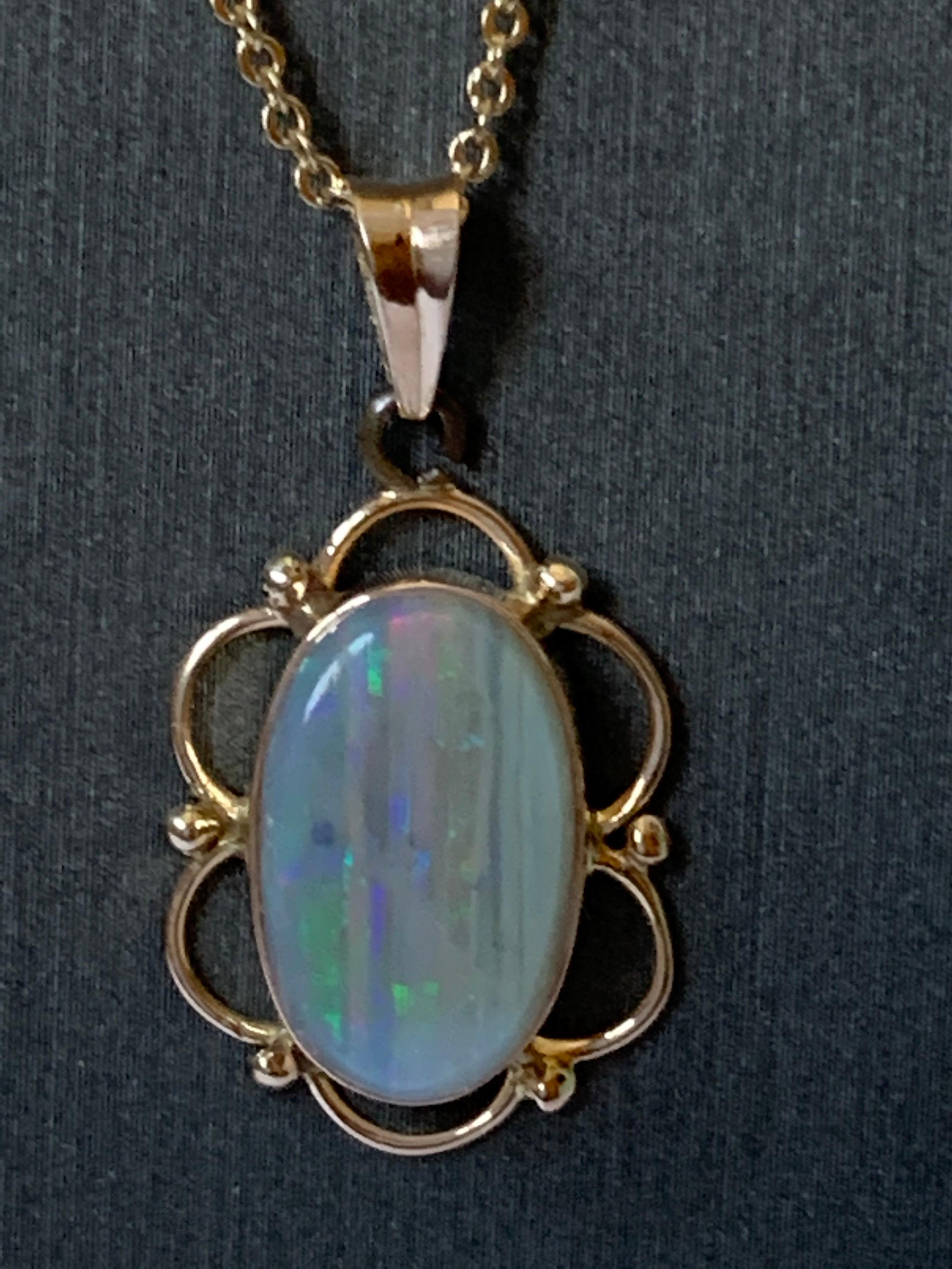 Natural opal pendant set in 14 Karat Yellow Gold For Sale at 1stDibs