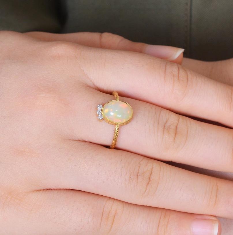 This ring is made with a beautiful opal gemstone. The gemstone is set in a 18K yellow gold textured .This ring would make the perfect gift for any occasion.

Specifications:

Dimensions: Ring Size-7.75 US, Top-13*9MM
Gross Weight: 2.180 gms
Gold
