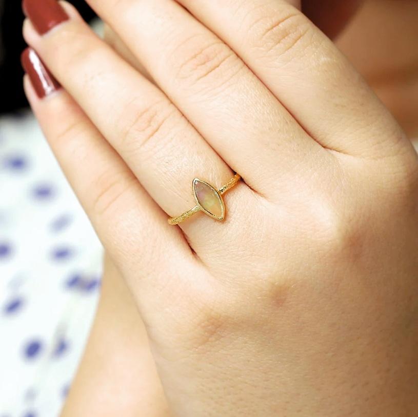 This ring is made of solid 18K yellow gold and has a beautiful opal gemstone texture. It would make a great addition to any jewelry collection.

Specifications

Dimensions: Length: 1.1 cm, Width: 0.5 cm
Gross Weight: 1.510 gms
Gold Weight: 1.430