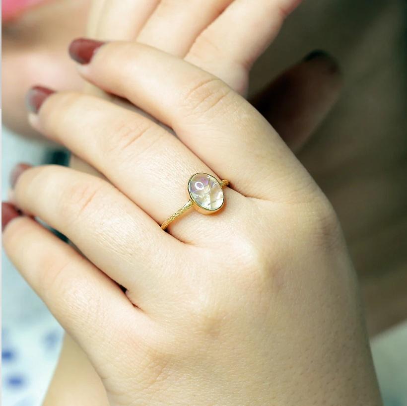Make love a priority by gifting this timeless opal solitaire ring that is sure to bring the widest smile on your partner's face. Set is 18K yellow gold, the ring features a handsome opal gemstone crafted to perfection by our expert