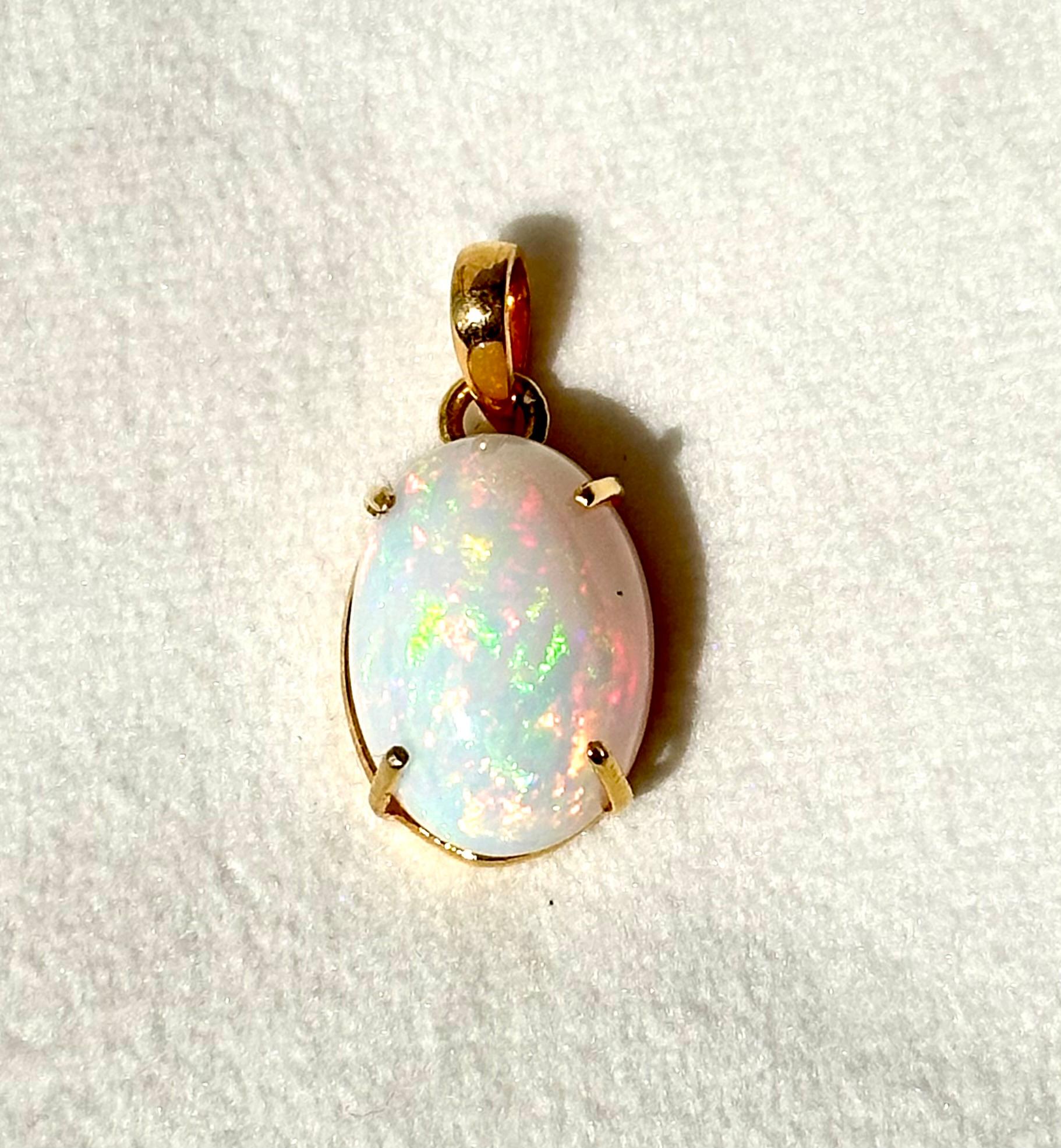 This is a beautiful opal stone set in 14K gold. It consists of:
Gross weight- 4.270g

Gemstone- Natural opal
Gemstone weight- 12.62ct
Gemstone origin- Ethiopia

Metal- Solid Gold
Metal purity- 14K yellow gold

