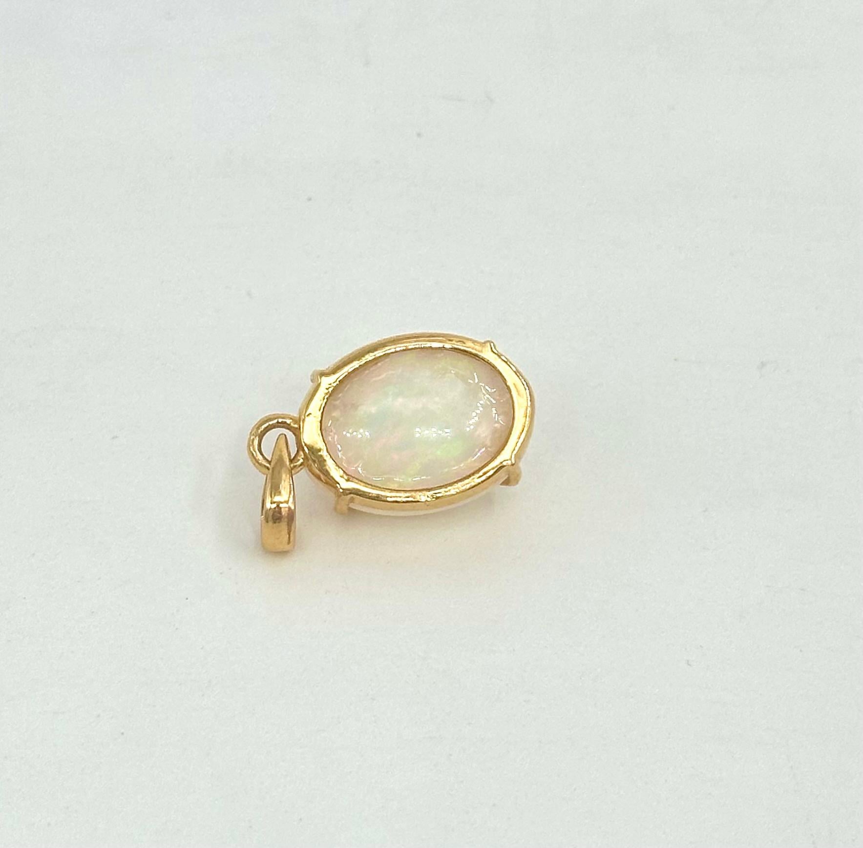 Women's or Men's 12.62ct Ethiopian opal stone in 14k yellow gold for pendant For Sale