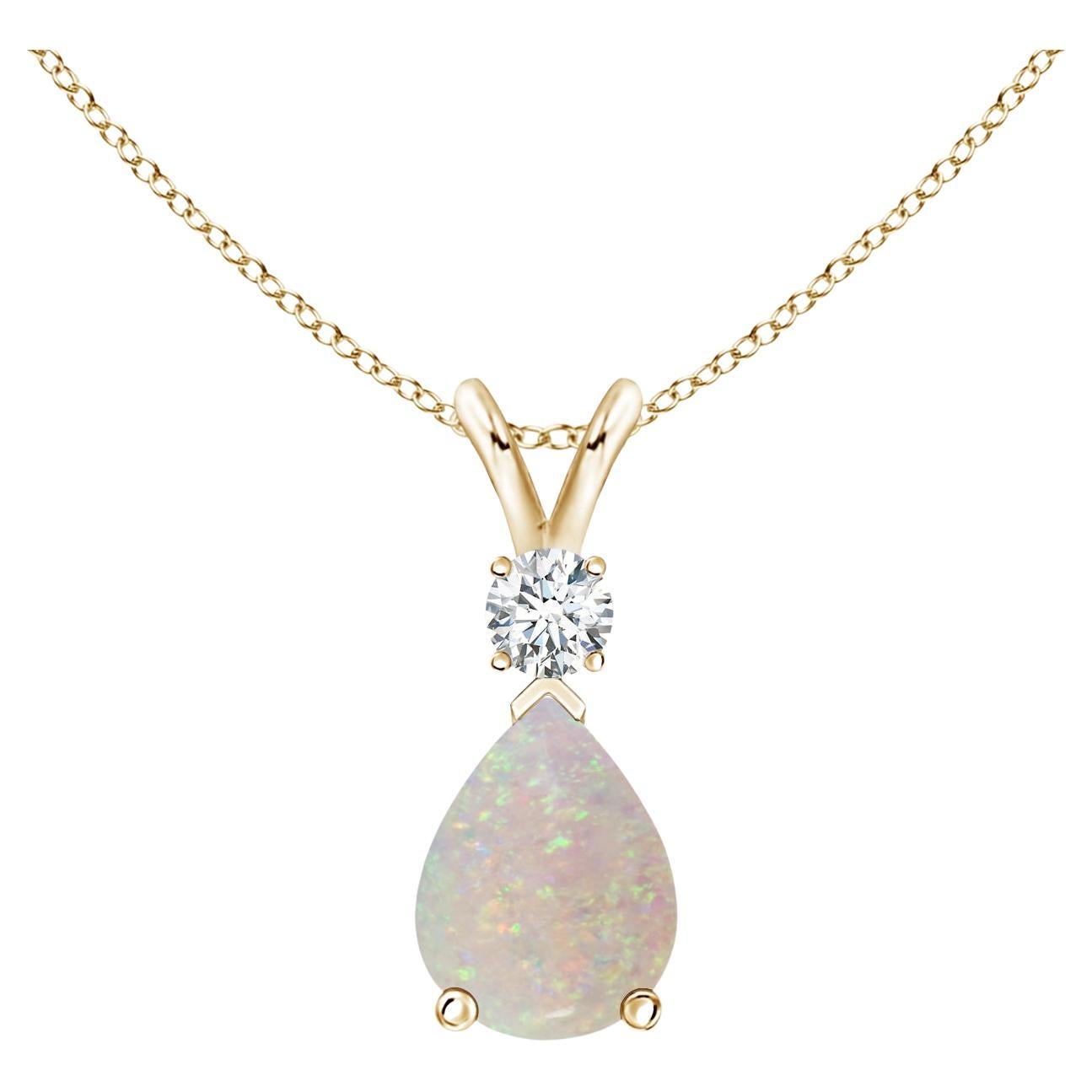 ANGARA Natural 0.70ct Opal Teardrop Pendant with Diamond in 14K Yellow Gold For Sale