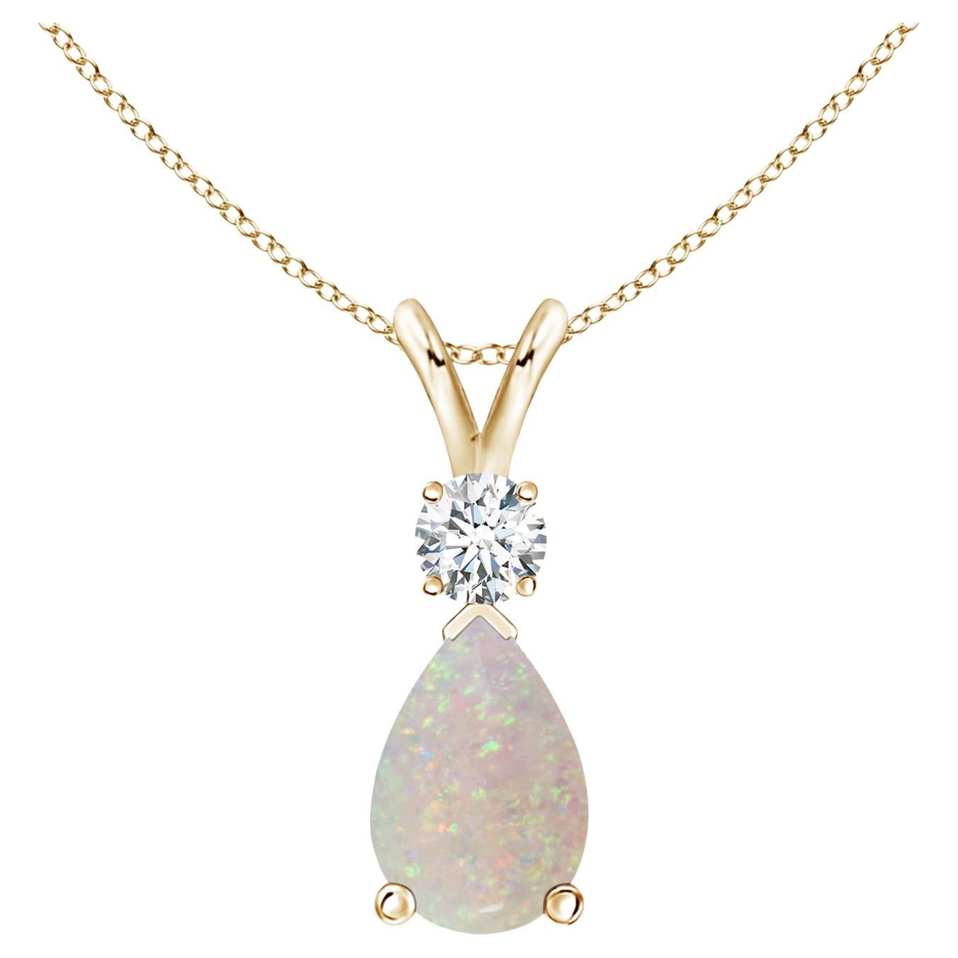 ANGARA Natural 0.90ct Opal Teardrop Pendant with Diamond in 14K Yellow Gold For Sale