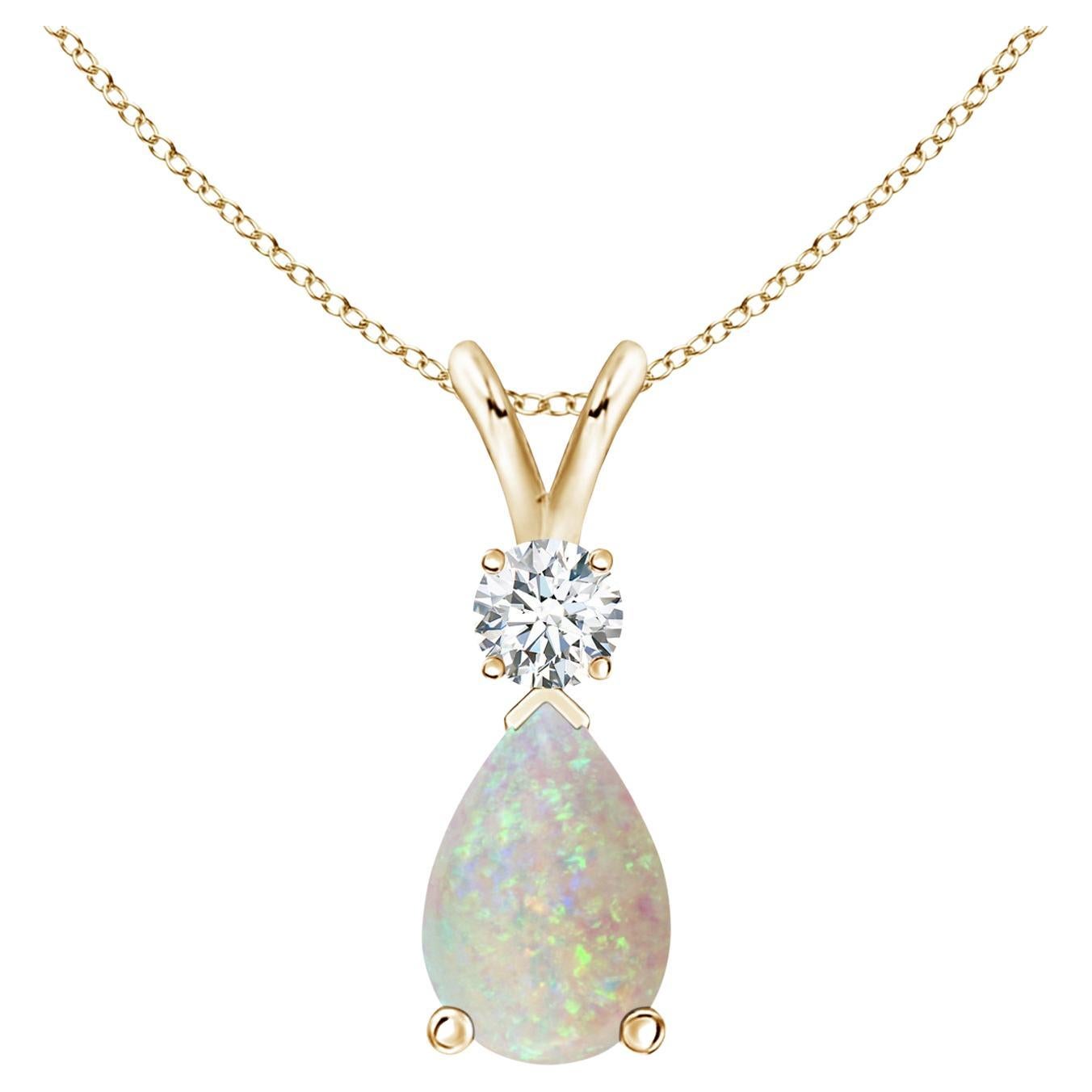 ANGARA Natural 0.90ct Opal Teardrop Pendant with Diamond in 14K Yellow Gold For Sale