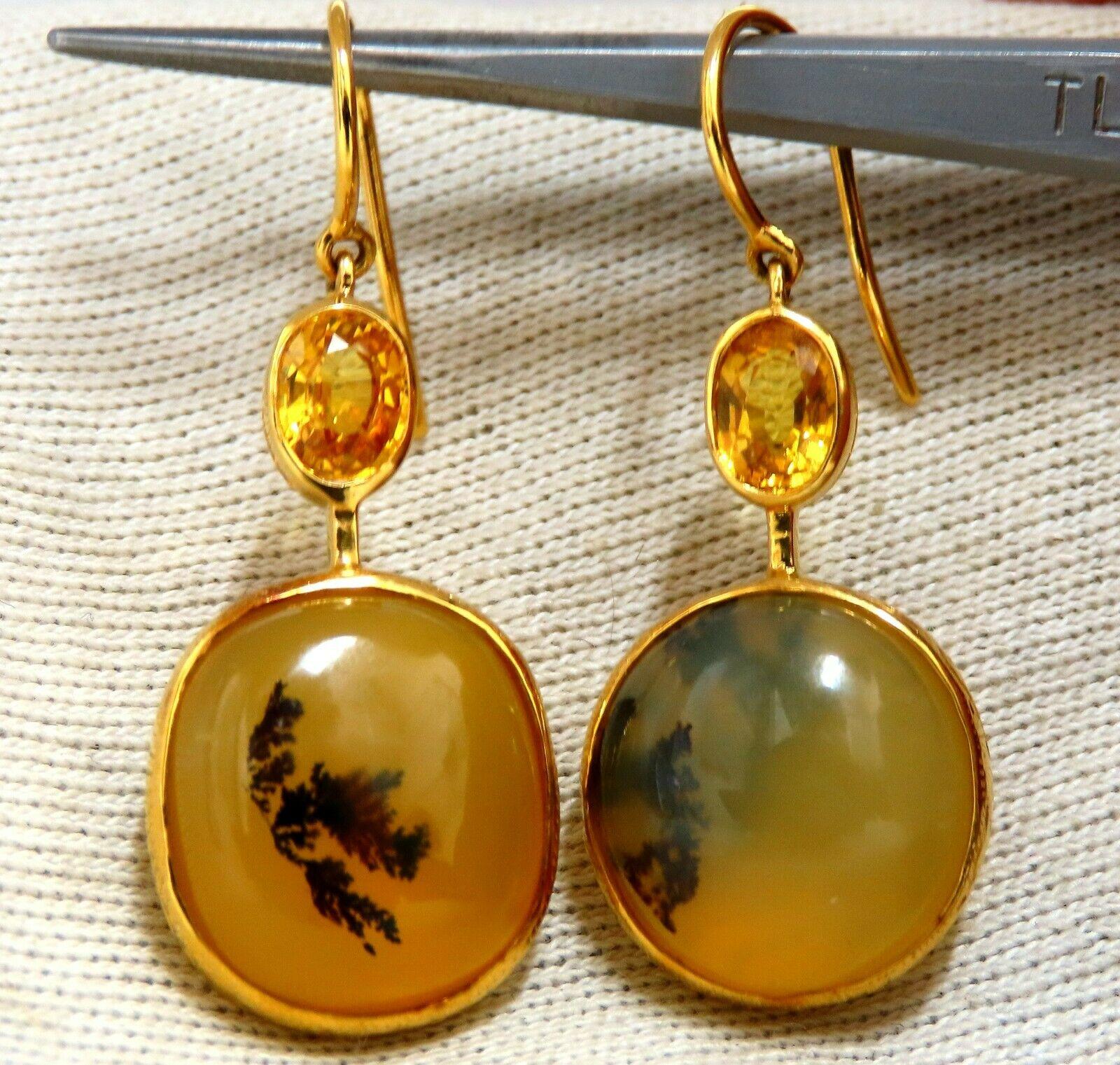 Natural Opal Sapphire Earrings

16 x 14mm Natural Opal earrings

Clean Clarity & Embedded Plant Material

Cabochon cut 

2.20ct natural yellow sapphires. 

Earrings:

1.6 inch long

8.8 grams.

18kt yellow gold

Earrings are gorgeous made
