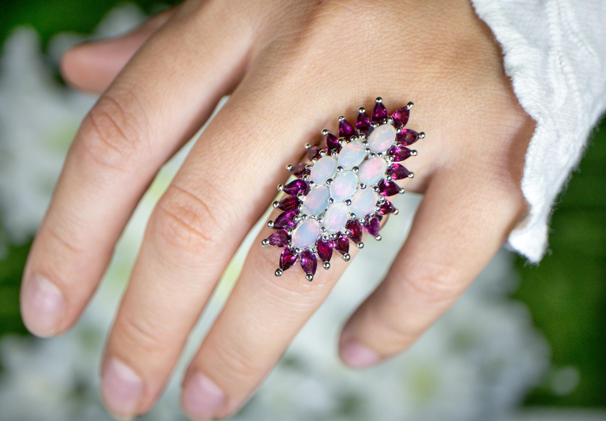 It comes with the Gemological Appraisal by GIA GG/AJP
All Gemstones are Natural
9 Opals = 2.45 Carats
22 Rhodolite Garnets = 5.95 Carats
Metal: Rhodium Plated Sterling Silver
Ring Size: 6* US
*It can be resized complimentary