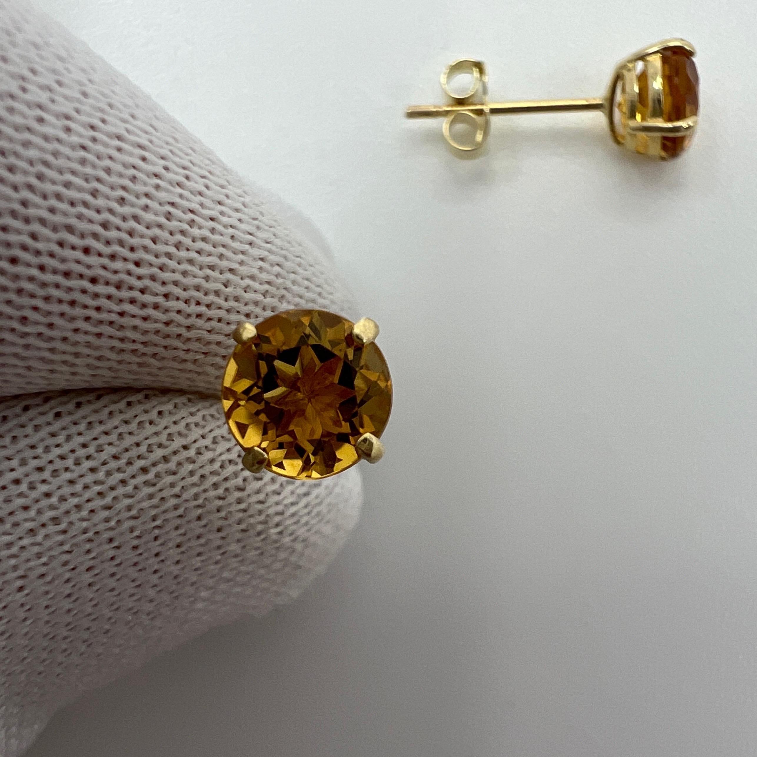 Natural Orange Yellow Champagne Topaz Yellow Gold Earring Studs.

1.15 Carat total. Beautiful 5mm matching pair of round topaz with a vivid orange-yellow champagne colour, excellent clarity and an excellent round brilliant cut.

The gemstones may