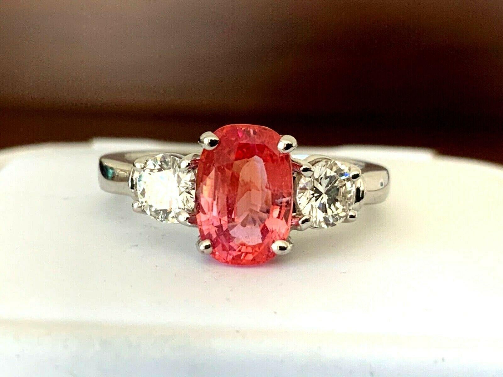 JUST IN TIME FOR THE HOLIDAYS!

We have been able to purchase one of the NICEST, Natural 2.08 carat Madagascar Orangy Pink Padparadscha sapphires we have ever seen.  Do your homework and you will realize how rare and expensive Padparadscha