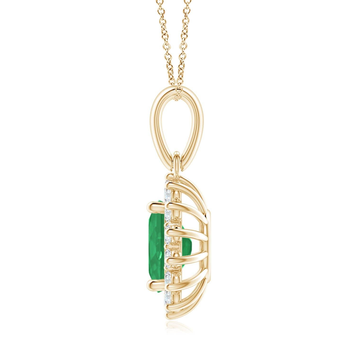 This enchanting emerald and diamond halo dangle pendant will steal hearts with its exquisiteness. An oval lush green emerald at the center is surrounded by sparkling white diamonds to create a beautiful floral design. Sculpted in 14k yellow gold,