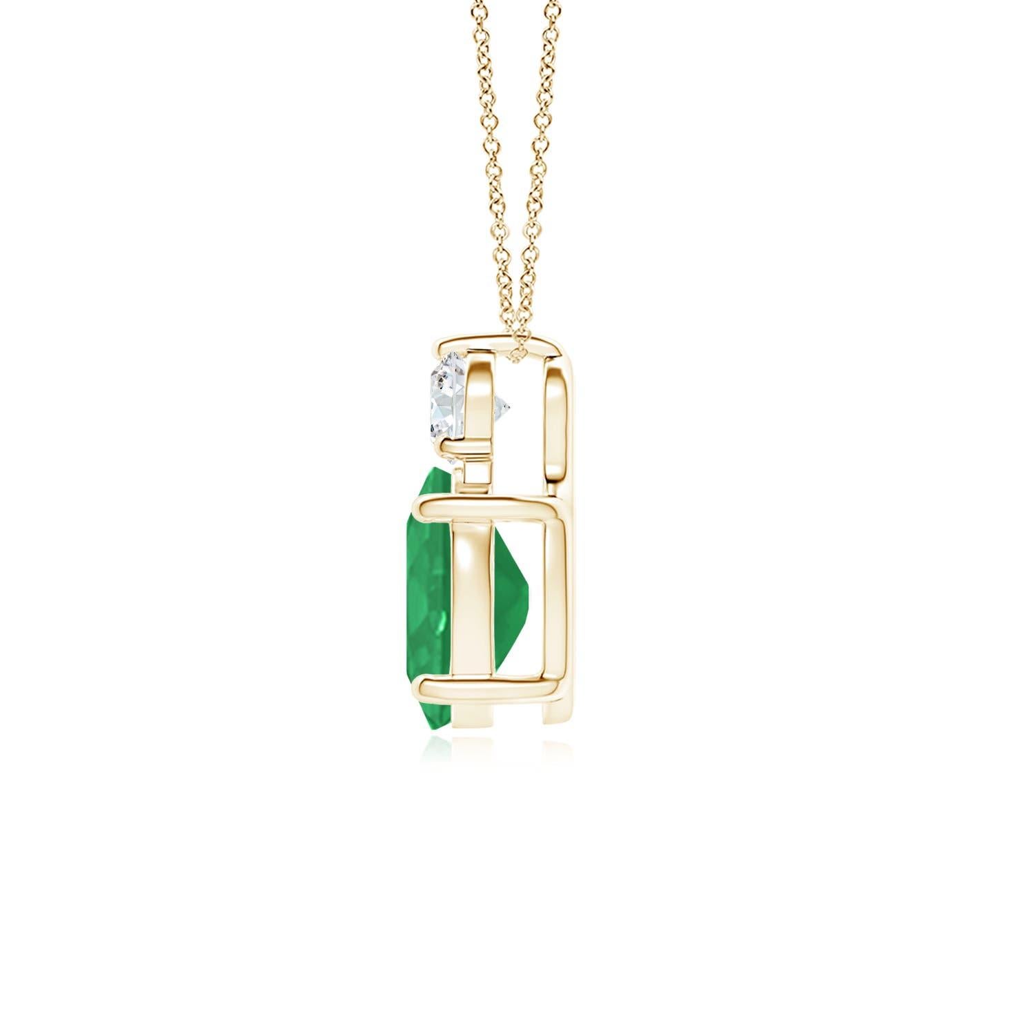 Crafted in 18k yellow gold, this classic solitaire emerald pendant personifies elegance. The rich green oval emerald is topped by a sparkling diamond for added allure. The intricate scroll work on the sides enhances this prong set emerald pendant's
