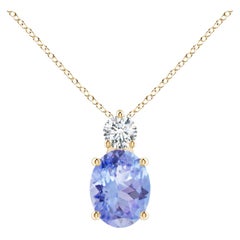 Ciondolo solitario di tanzanite ovale naturale da 1,9 carati con diamante in oro giallo 18 carati