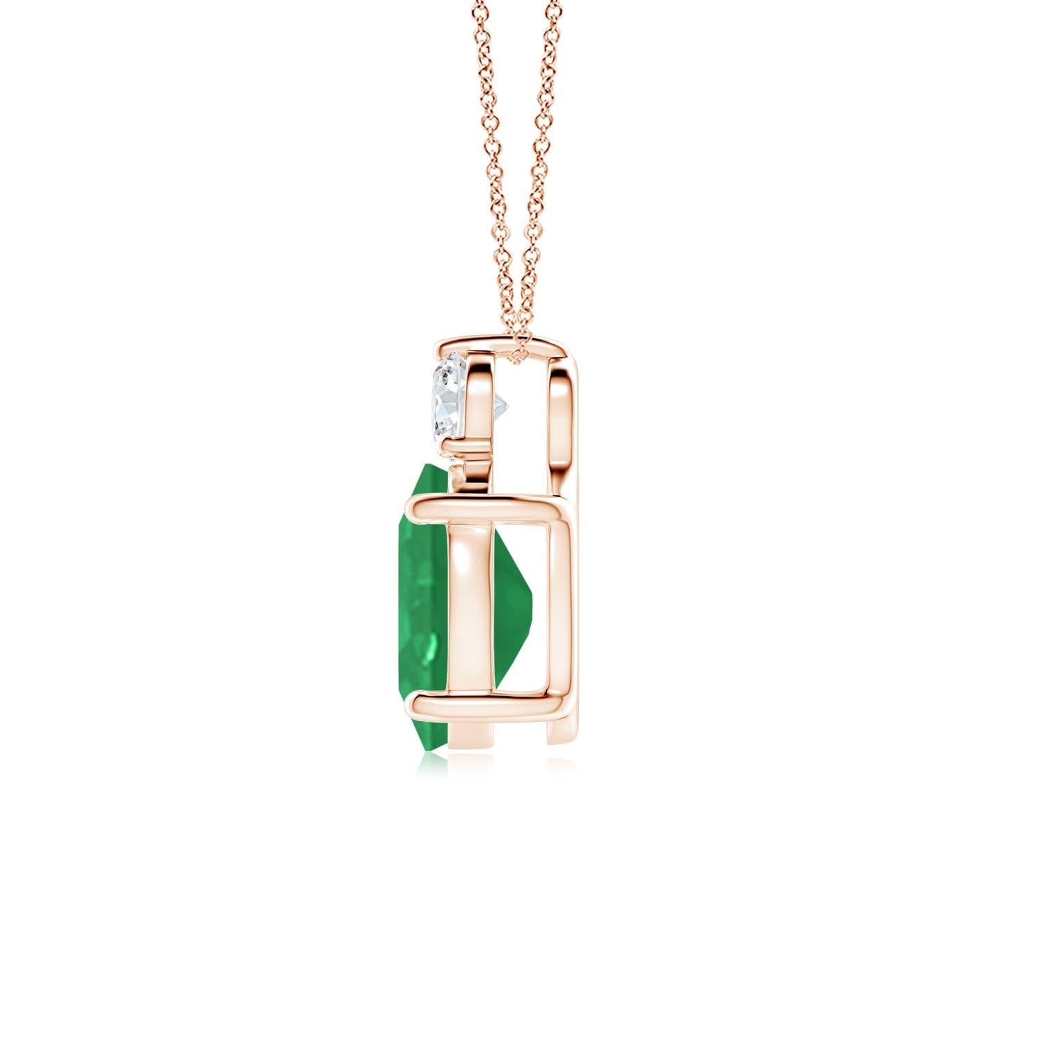 Crafted in 18k rose gold, this classic solitaire emerald pendant personifies elegance. The rich green oval emerald is topped by a sparkling diamond for added allure. The intricate scroll work on the sides enhances this prong set emerald pendant's