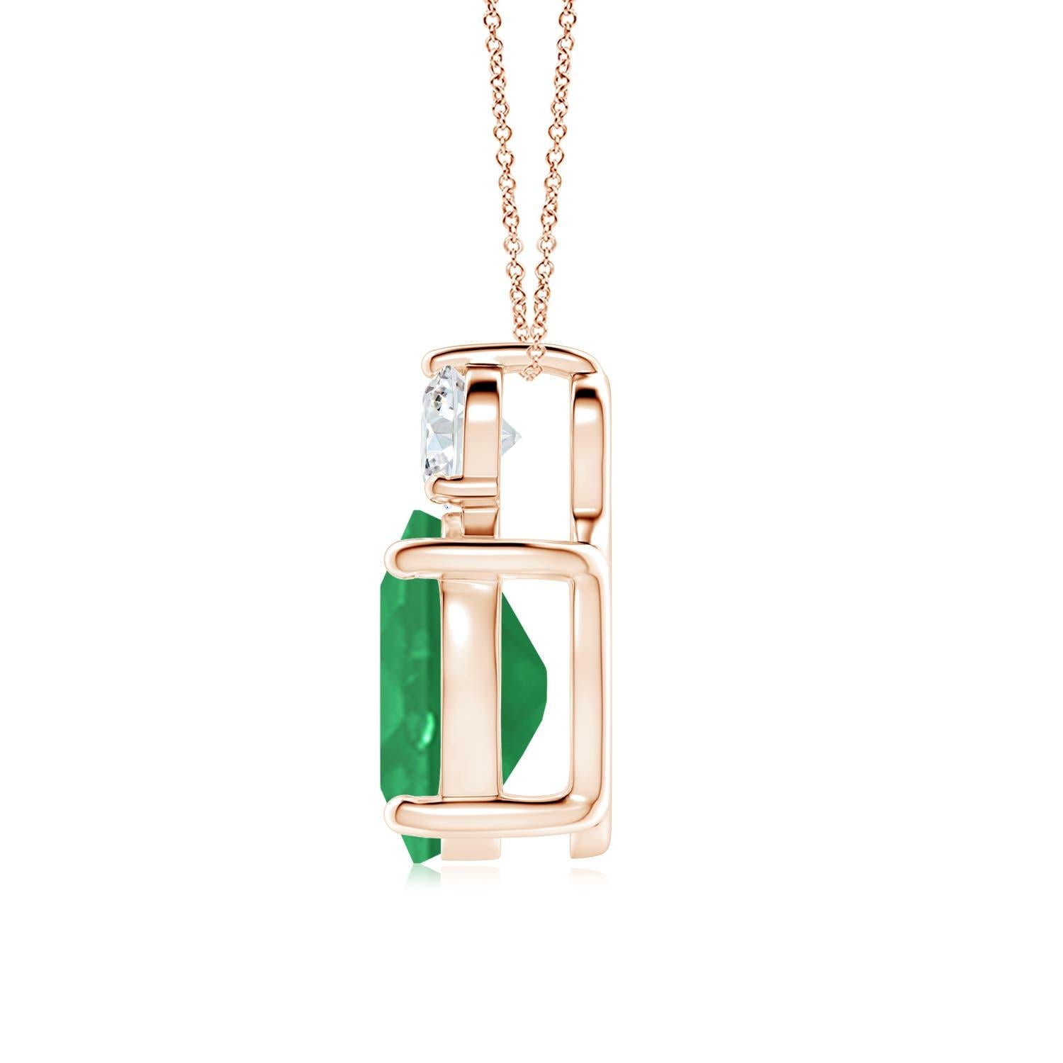 Crafted in 14k rose gold, this classic solitaire emerald pendant personifies elegance. The rich green oval emerald is topped by a sparkling diamond for added allure. The intricate scroll work on the sides enhances this prong set emerald pendant's
